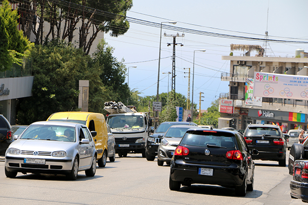 Cars weave in and out on roads where lanes mean nothing. Image by Ari Daniel. Lebanon, 2014. Media file: cars05b.jpg
