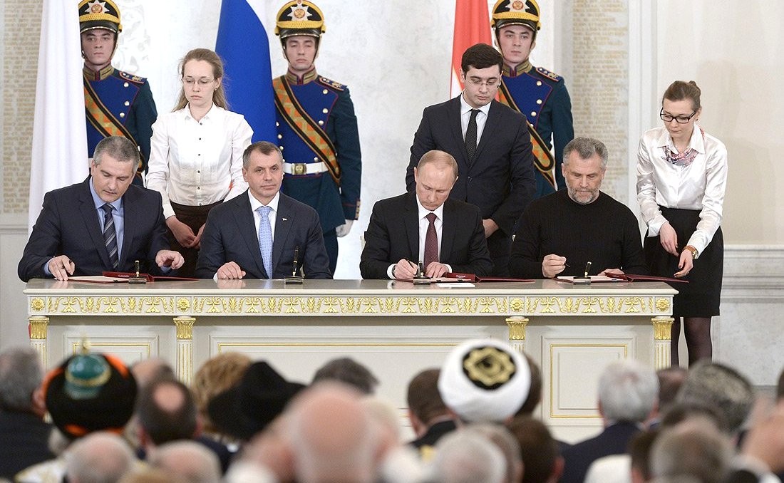 Agreement on the accession of the Republic of Crimea to the Russian Federation signed. Image courtesy of the Office of the President of Russia. Agreement on the accession of the Republic of Crimea to the Russian Federation signed. Image courtesy of the Office of the President of Russia.