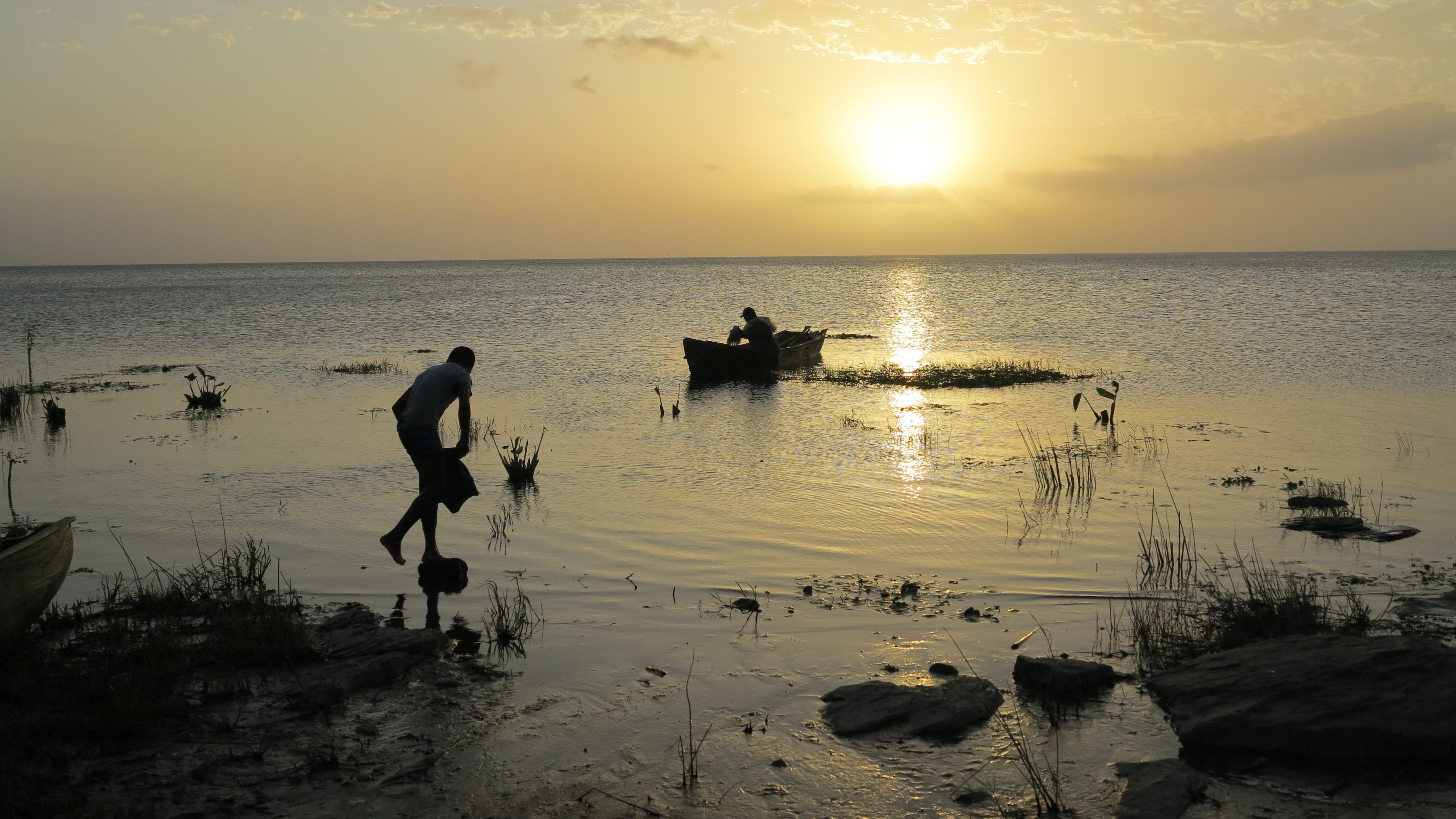 The proposed canal would cross the lake several miles south of where this boy balances on a rock at the edge of the eastern shore of Lake Nicaragua. Image by Tim Johnson/McClatchy. Nicaragua, 2015. Media file: nicacanal-secrecy_03.jpg