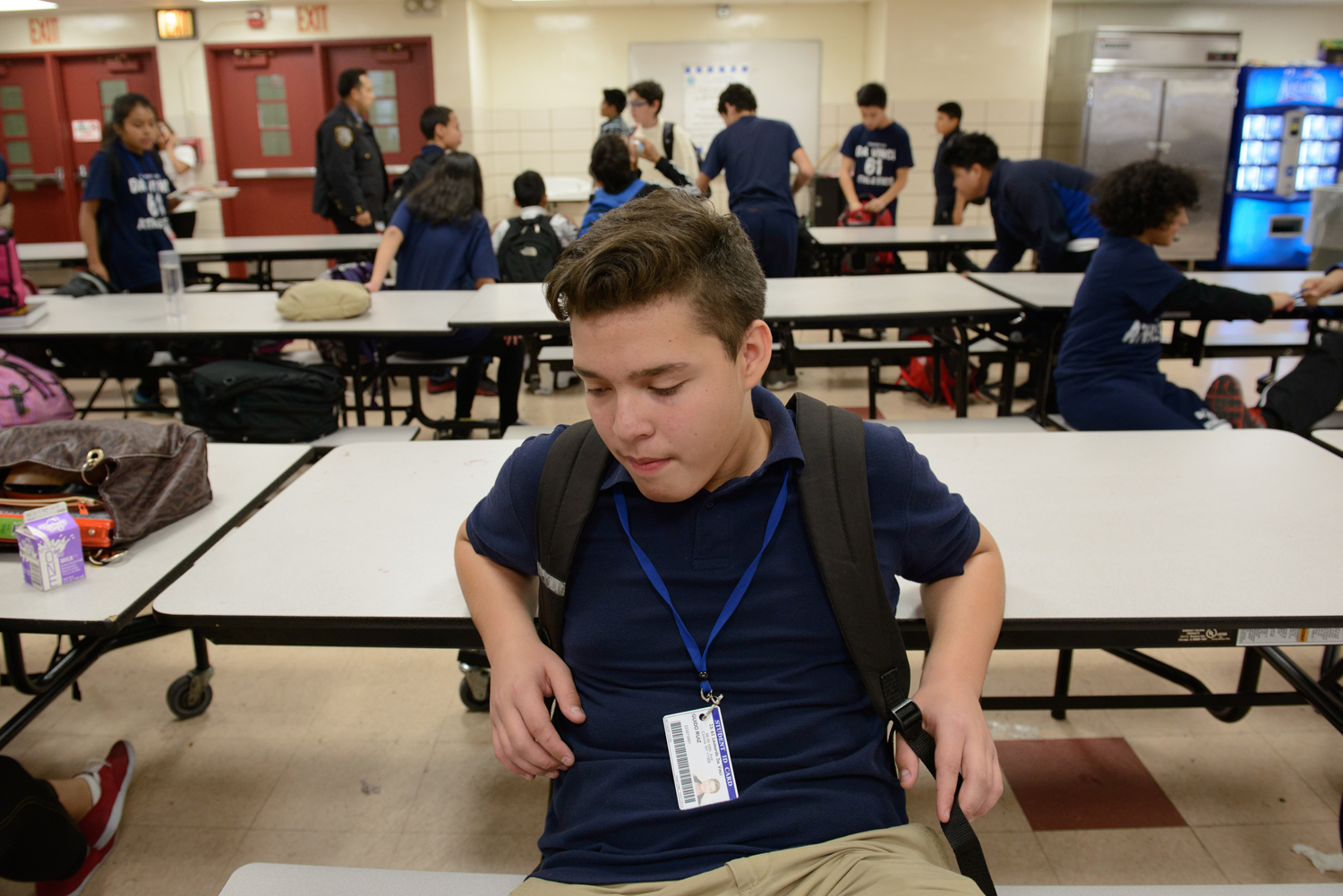 Guido at lunchtime in his middle school cafeteria. Image by Alice Proujansky. United States, 2014.