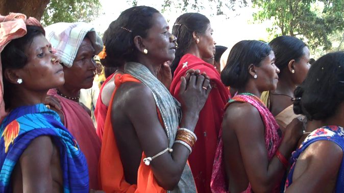Adivasi women at a festival intended to bring their community together with the police, with whom the Naxalites or Maoists often clash in bloody battles. Image by Simone Ahuja. India, 2013. Media file: adivasi_women_at_police_festival.png