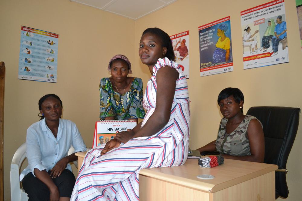 (L-R) Ruth Aliyu, 28, Mercy Wasa, 41 and Helen Momoh, 29, and (seated) Linda Alkali, 26, are part of a support group for HIV-positive pregnant women in Nigeria called "Mentoring Mothers." Image by Ameto Akpe. Nigeria, 2013. Media file: nigeria_women.jpg