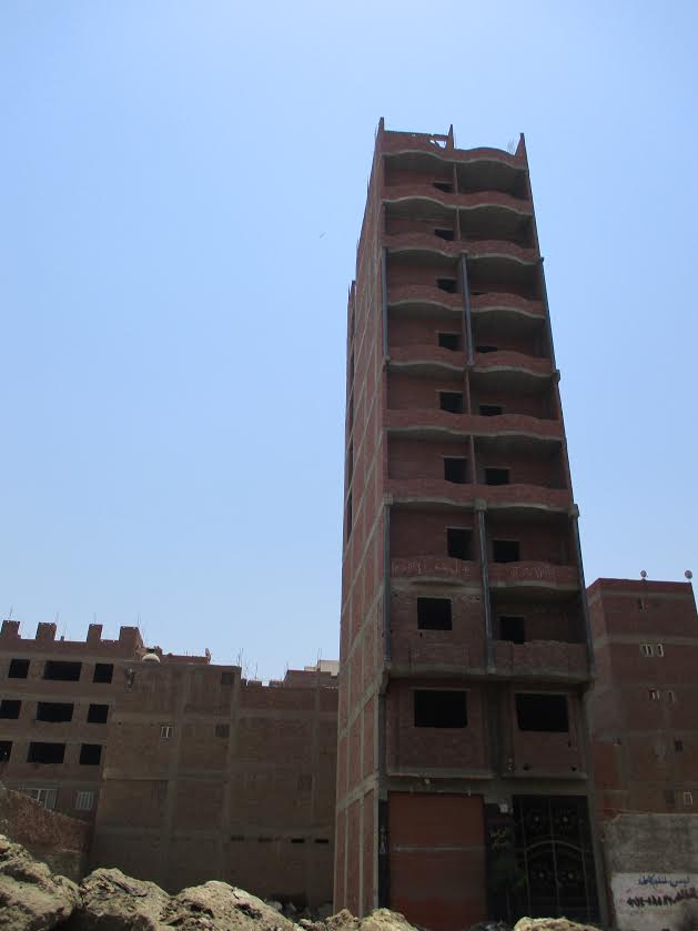 A newly-built apartment block in Kafr. Each floor of a new building is worth several times what a farmer can earn in a year by farming the same amount of land. Image by Jahd Khalil. Egypt, 2017. A newly-built apartment block in Kafr. Each floor of a new building is worth several times what a farmer can earn in a year by farming the same amount of land. Image by Jahd Khalil. Egypt, 2017.