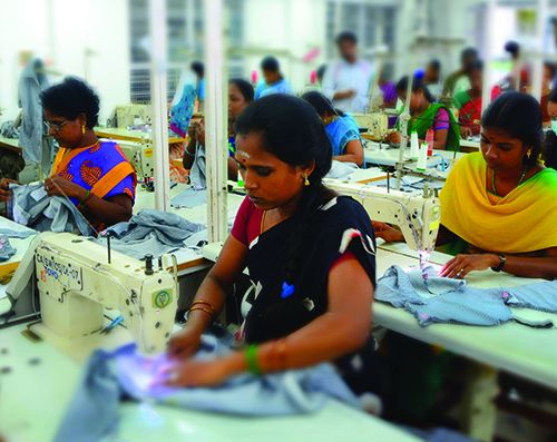 Eighty percent of the 200-plus factory workers at fair-trade-certified Mandala Apparels are women. Here they stich and inspect garments in Mandala’s Puducherry, India, factory. Image courtesy of Dhana. India. India garment factory