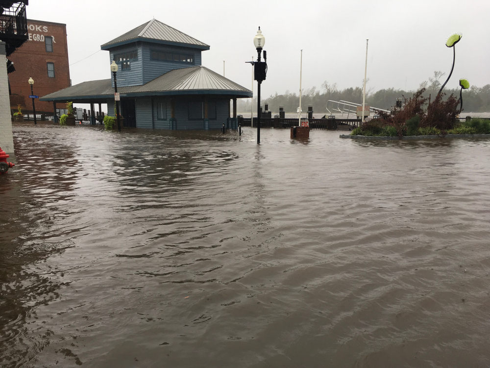 Wilmington North Carolina - USA / September 14, 2018. Downtown Wilmington begins to flood from storm surges. Visitor center on the foot of Market and Water St covered half way with flood waters. Image by MicheleMidnight / Shutterstock.com. United States, 2018. Wilmington North Carolina - USA / September 14, 2018. Downtown Wilmington begins to flood from storm surges. Visitor center on the foot of Market and Water St covered half way with flood waters. Image by MicheleMidnight / Shutterstock.com. United States, 2018.