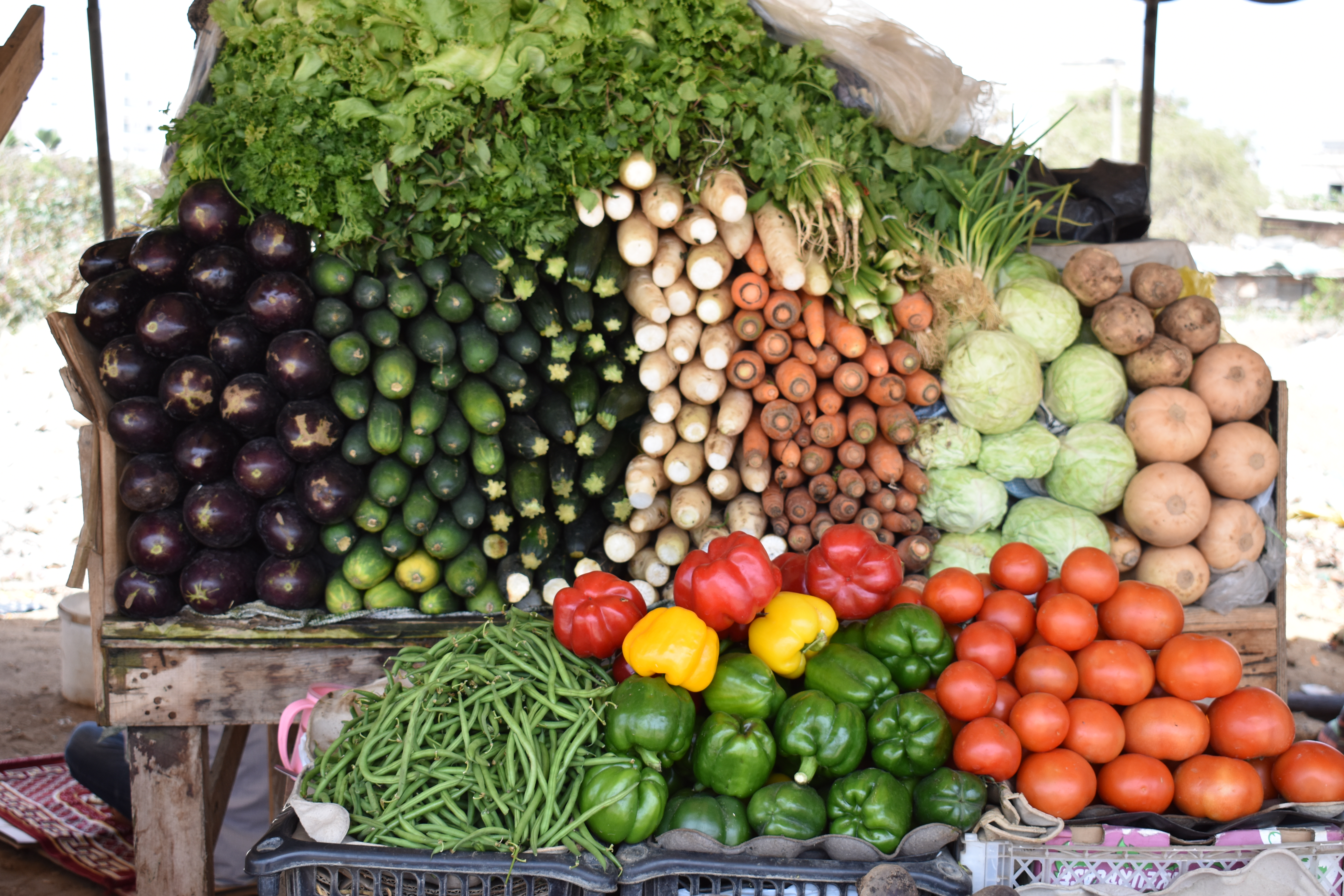 A wide variety of vegetables can be purchased at market stalls across Dakar. However, many of these vegetables are not part of the traditional meals in Senegal, and therefore are not frequently consumed. Image by Amy Nye. Senegal, 2019. Vegetables sold at a market stall. Image by Amy Nye. Senegal, 2019.
