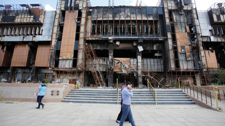 Iraqi students walk near a building of the central Library of the University of Mosul, May 14, 2018. Image by Khalid Al-Mousily for Reuters. Iraq, 2018. Iraqi students walk near a building of the central Library of the University of Mosul, May 14, 2018. Image by Khalid Al-Mousily for Reuters. Iraq, 2018.