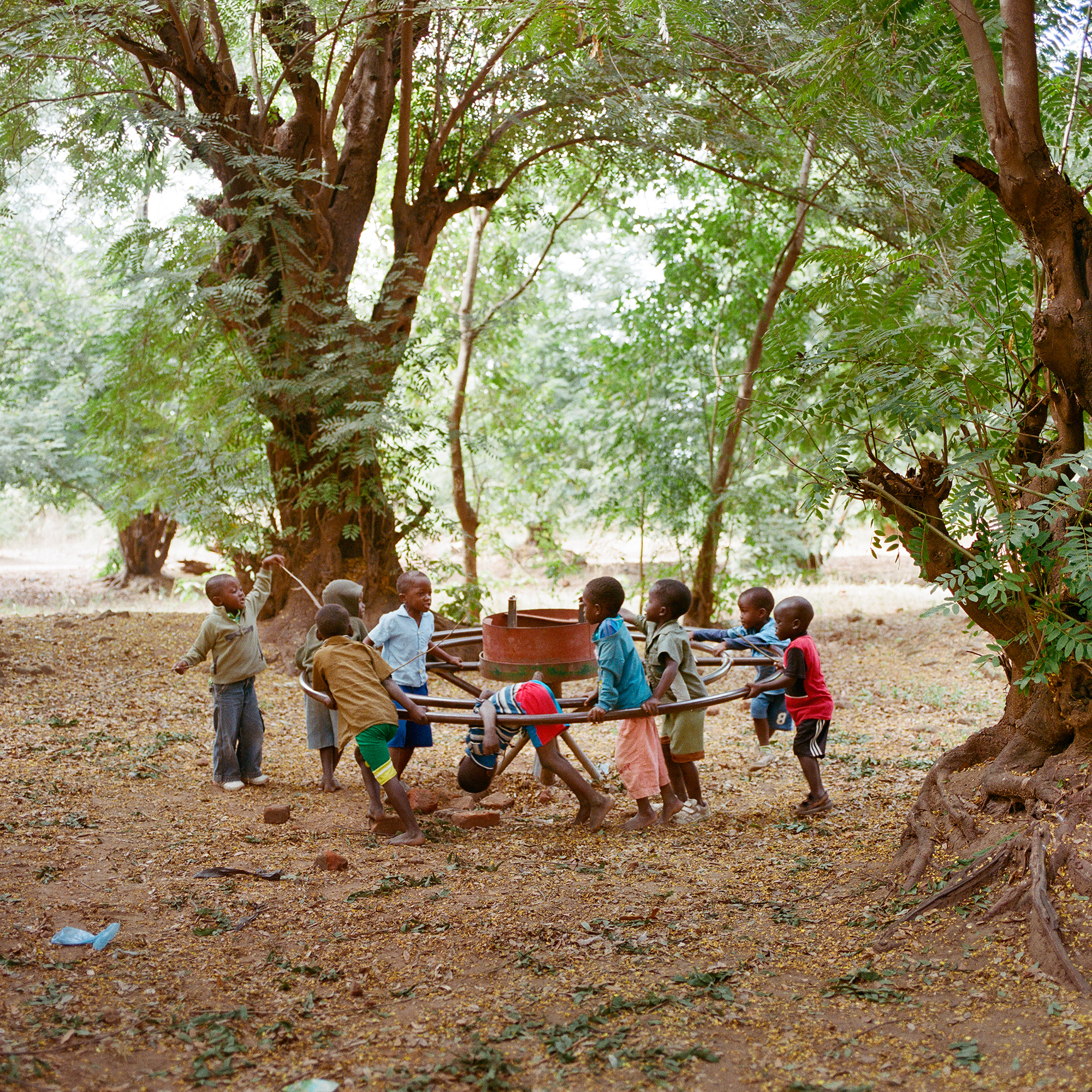 Children play on a broken PlayPump in Mfera, Chikhwawa District, Malawi, June 10, 2015. The PlayPump in Mfera was installed on February 11, 2009, and stopped working in April 2012. The organization that installed it replaced a perfectly working handpump, and the PlayPump never pumped as much water as the handpump. After the PlayPump broke, it was replaced with another handpump.