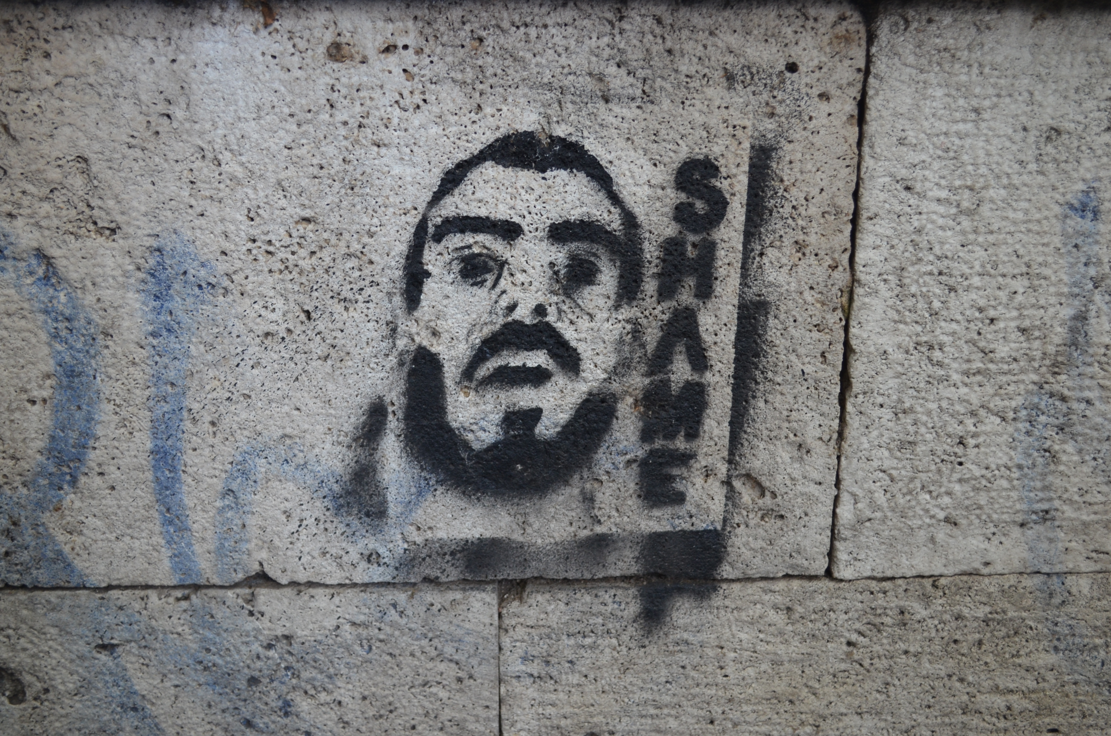 Anti-immigrant graffiti is splashed along the walls of the Tiber River, which runs through the center of Rome. Image by Amanda Ulrich. Italy, 2016. Anti-immigrant graffiti is splashed along the walls of the Tiber River, which runs through the center of Rome. Image by Amanda Ulrich. Italy, 2016.