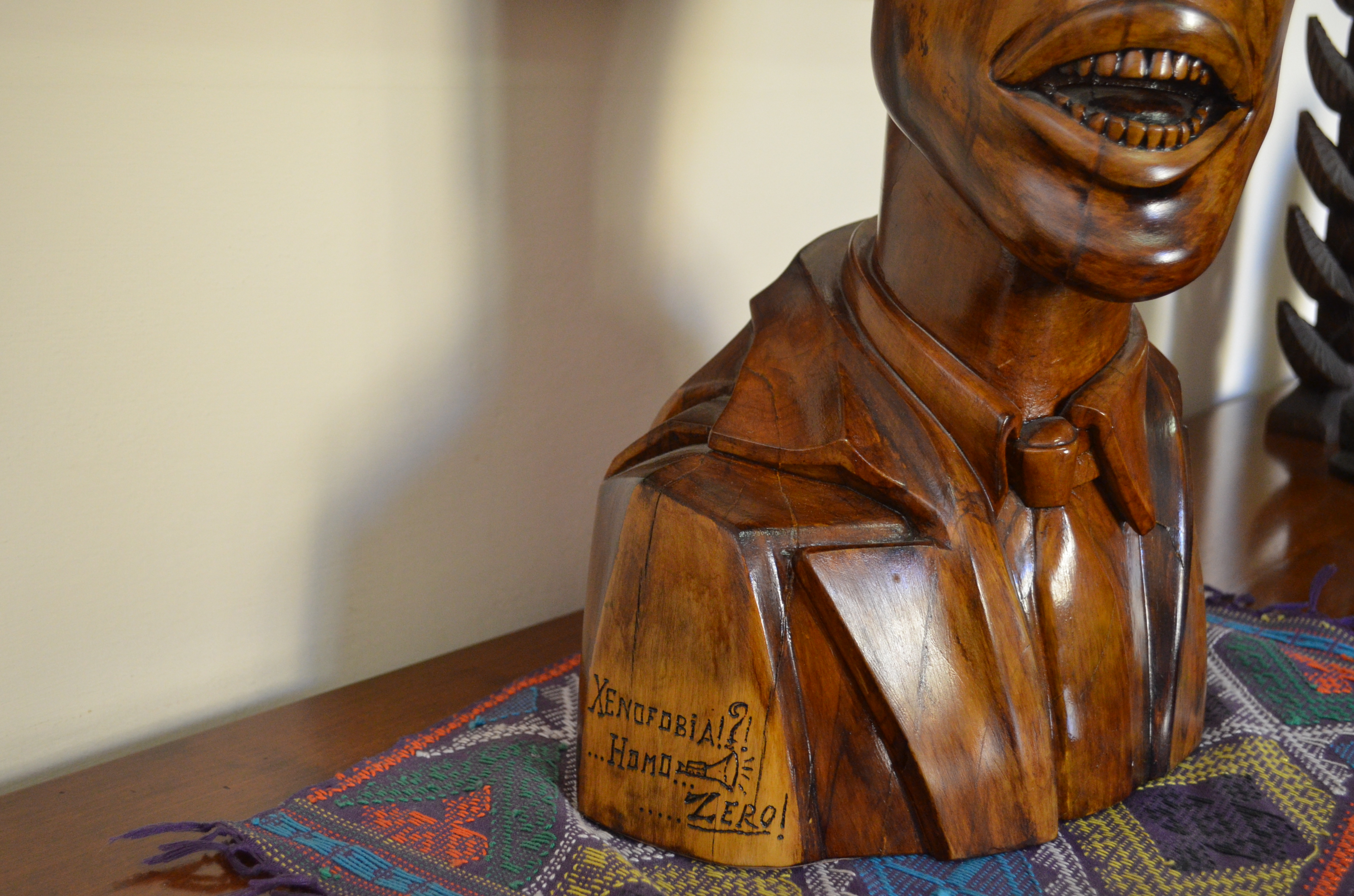 A wooden statue in Cardinal Peter Turkson's office reminds visitors of the work that still needs to be done to culturally unify Rome. Image by Amanda Ulrich. Italy, 2016.
