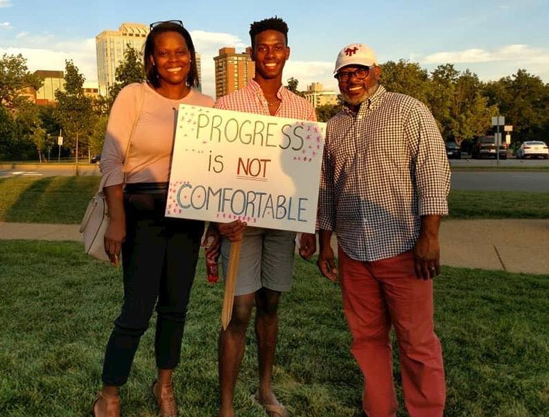 The Washingtons, Theo, Denise and their son, Teddy at a rally supporting racial equity in Clayton, Mo. Courtesy of the Washington family. United States, 2019. The Washingtons, Theo, Denise and their son, Teddy at a rally supporting racial equity in Clayton, Mo. Courtesy of the Washington family. United States, 2019.