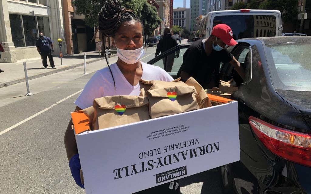 Tiffany Carter, La Cocina graduate and owner of food business Boug Cali delivers meals to Larkin Street Youth Services. Image courtesy of Natalia Gurevich. United States, 2020. Tiffany Carter, La Cocina graduate and owner of food business Boug Cali delivers meals to Larkin Street Youth Services. Image courtesy of Natalia Gurevich. United States, 2020.
