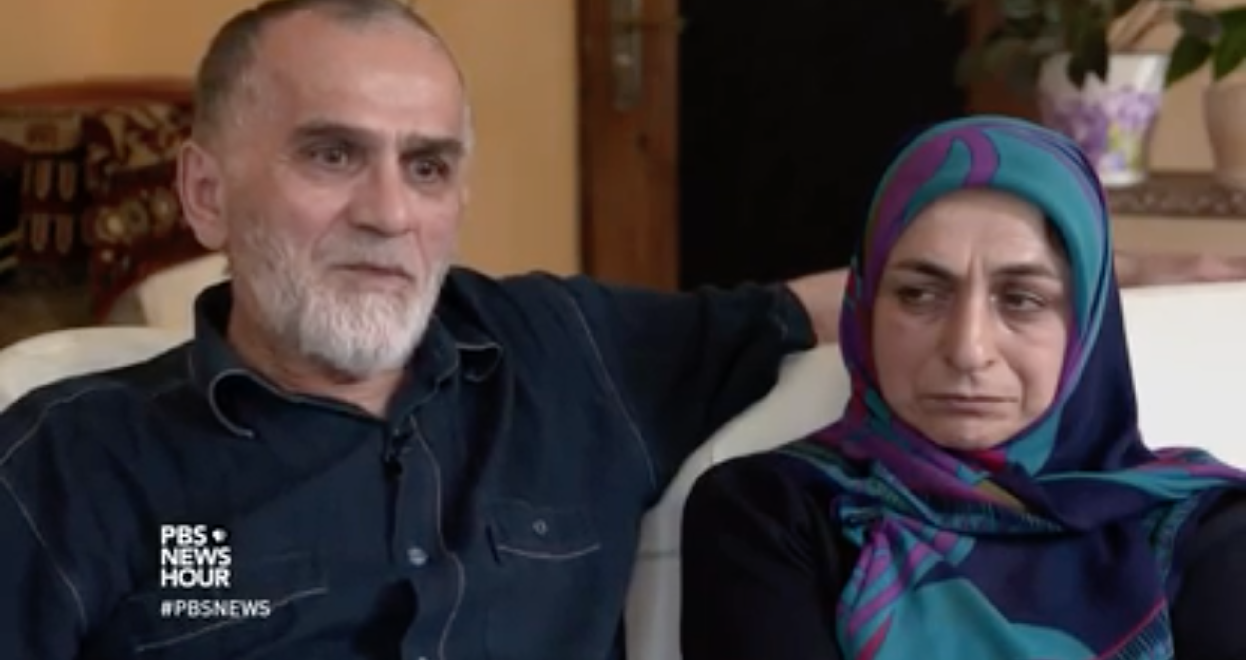 Kazim Nurmagometov and his wife talk to PBS about their son, Marat, who left Dagestan to go fight with ISIS. Image from PBS NewsHour. Russia, 2017. Kazim Nurmagometov and his wife talk to PBS about their son, Marat, who left Dagestan to go fight with ISIS. Image from PBS NewsHour. Russia, 2017.