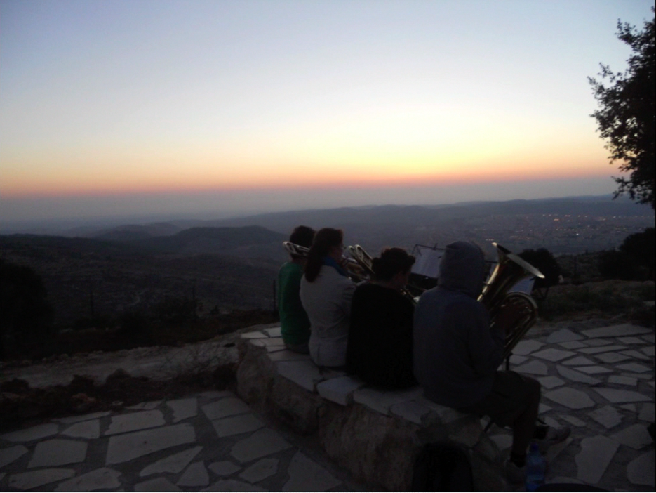 Brass for Peace at sunset. Image by Adrian Fadil. West Bank, 2013. Media file: brass_at_twiight.png