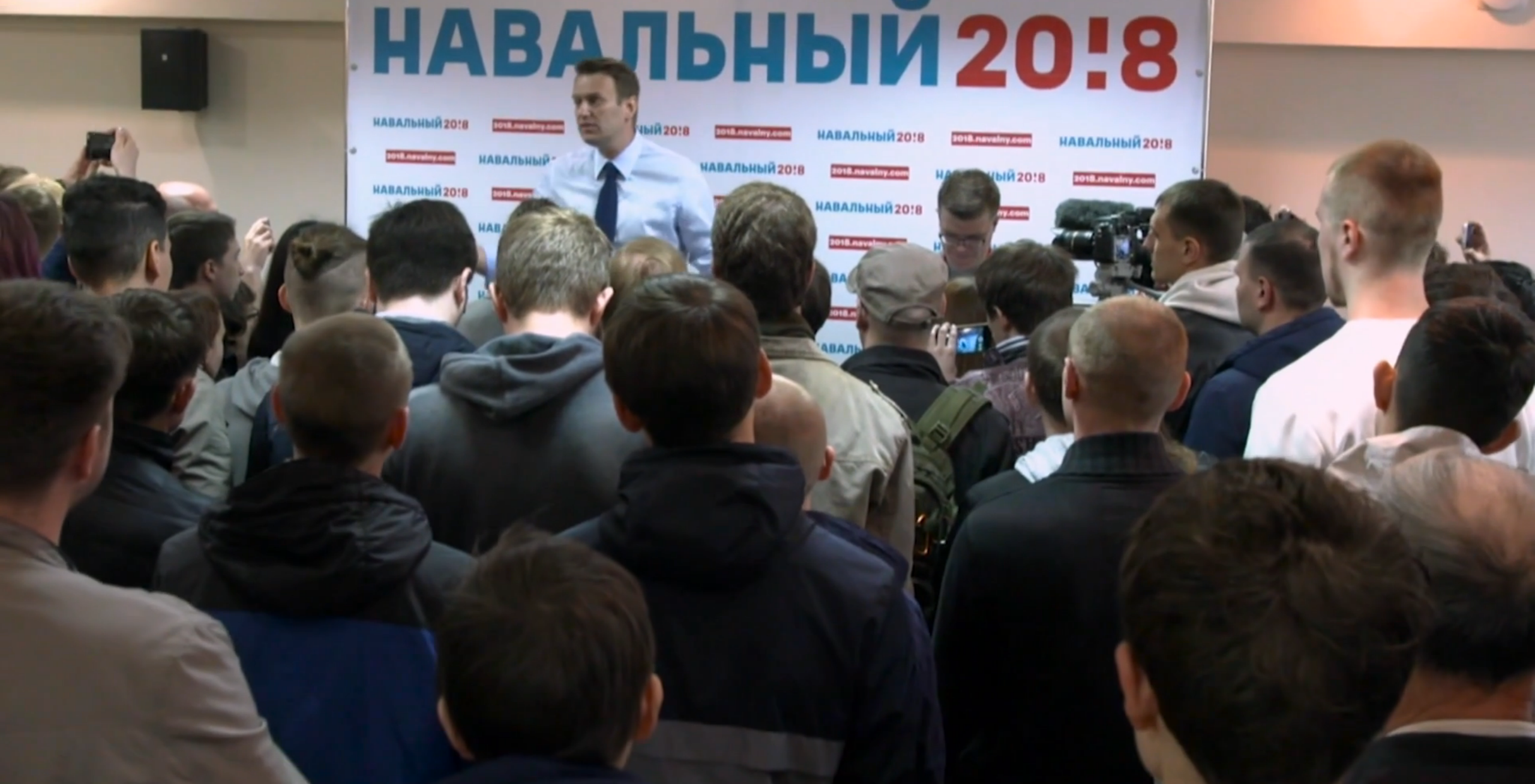 Alexei Navalny, Putin's opposition, at a campaign event. Image from PBS NewsHour. Russia, 2017. Alexei Navalny, Putin's opposition, at a campaign event. Image from PBS NewsHour. Russia, 2017.
