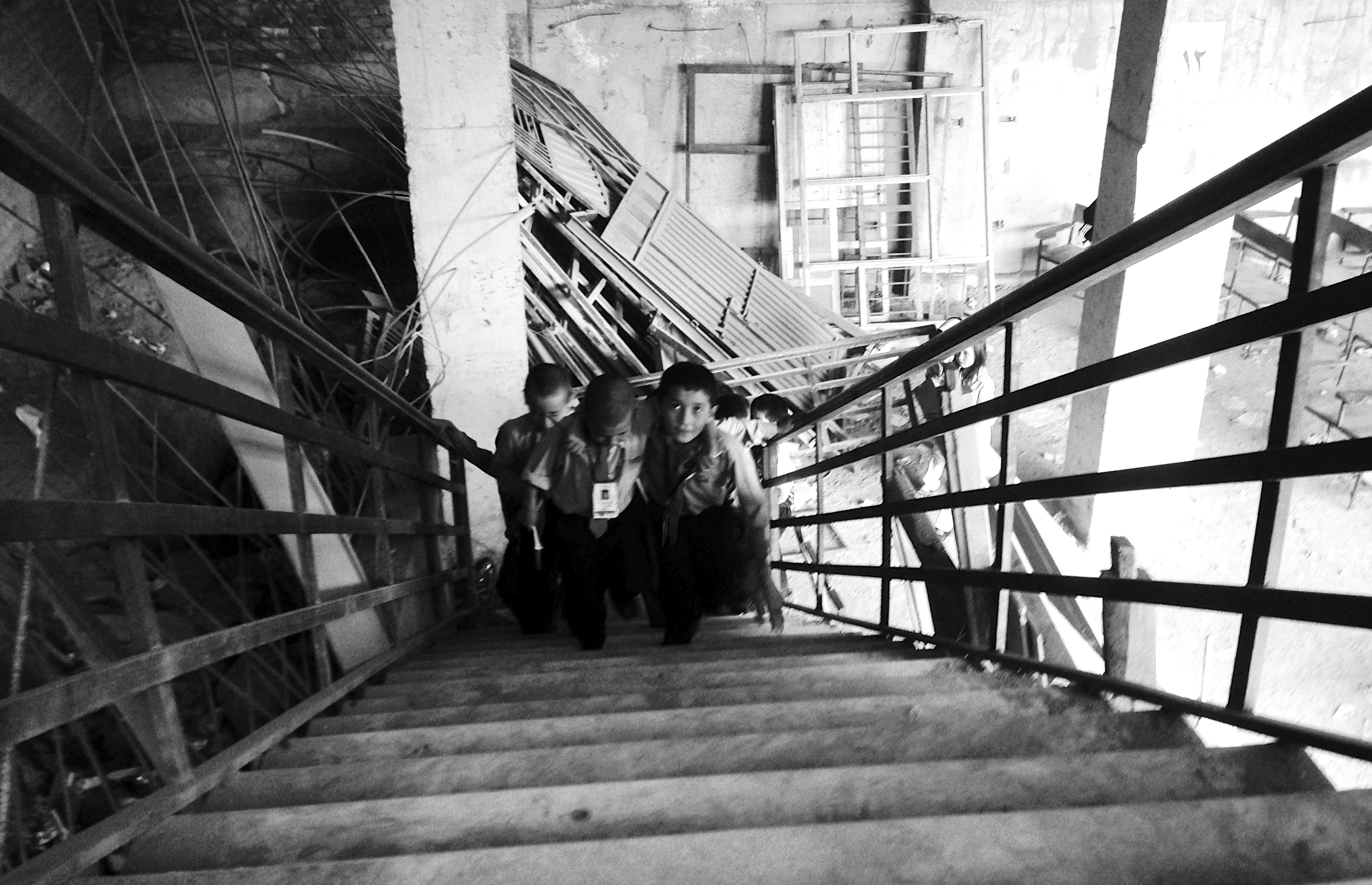 Schoolboys in Kabul coming from class. Despite ongoing Taliban violence and endemic graft in many sectors, Kabul has seen progress in education, construction, and business during the international presence." Image by Jeffrey E. Stern. Afghanistan, 2013. Media file: img_1013.jpg
