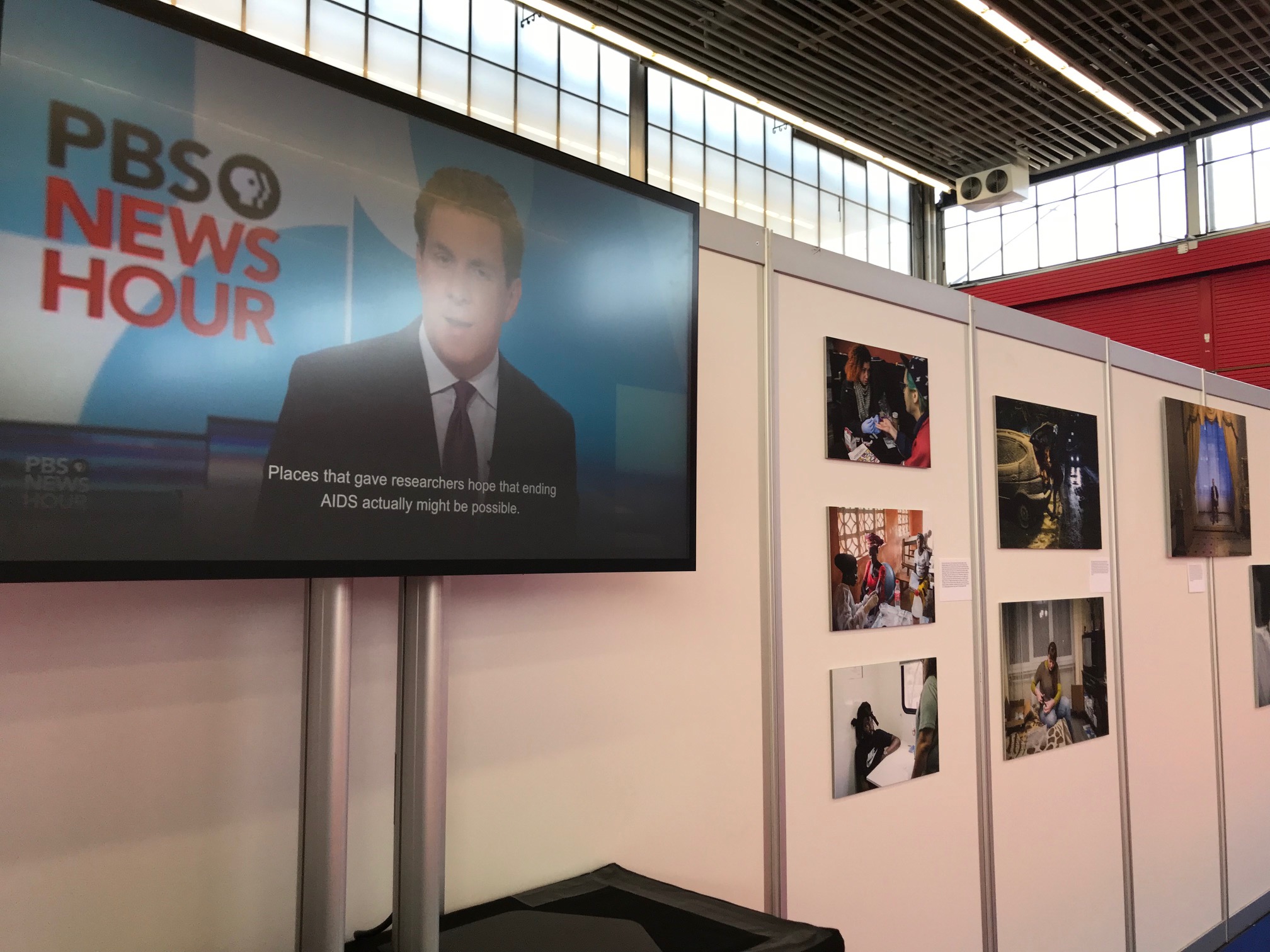A segment of the Science Magazine and PBS NewsHour "Far From Over" exhibit at the 2018 International AIDS Conference in Amsterdam. Image courtesy of Jon Cohen. The Netherlands, 2018. A segment of the Science Magazine and PBS NewsHour "Far From Over" exhibit at the 2018 International AIDS Conference in Amsterdam. Image courtesy of Jon Cohen. The Netherlands, 2018.