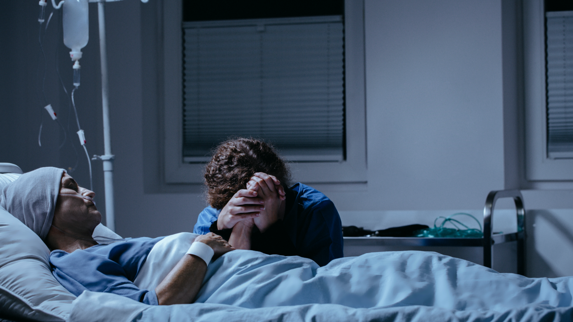 Image by Shutterstock. Daughter crying at her dying mother's bed in the hospital. Image by Shutterstock.
