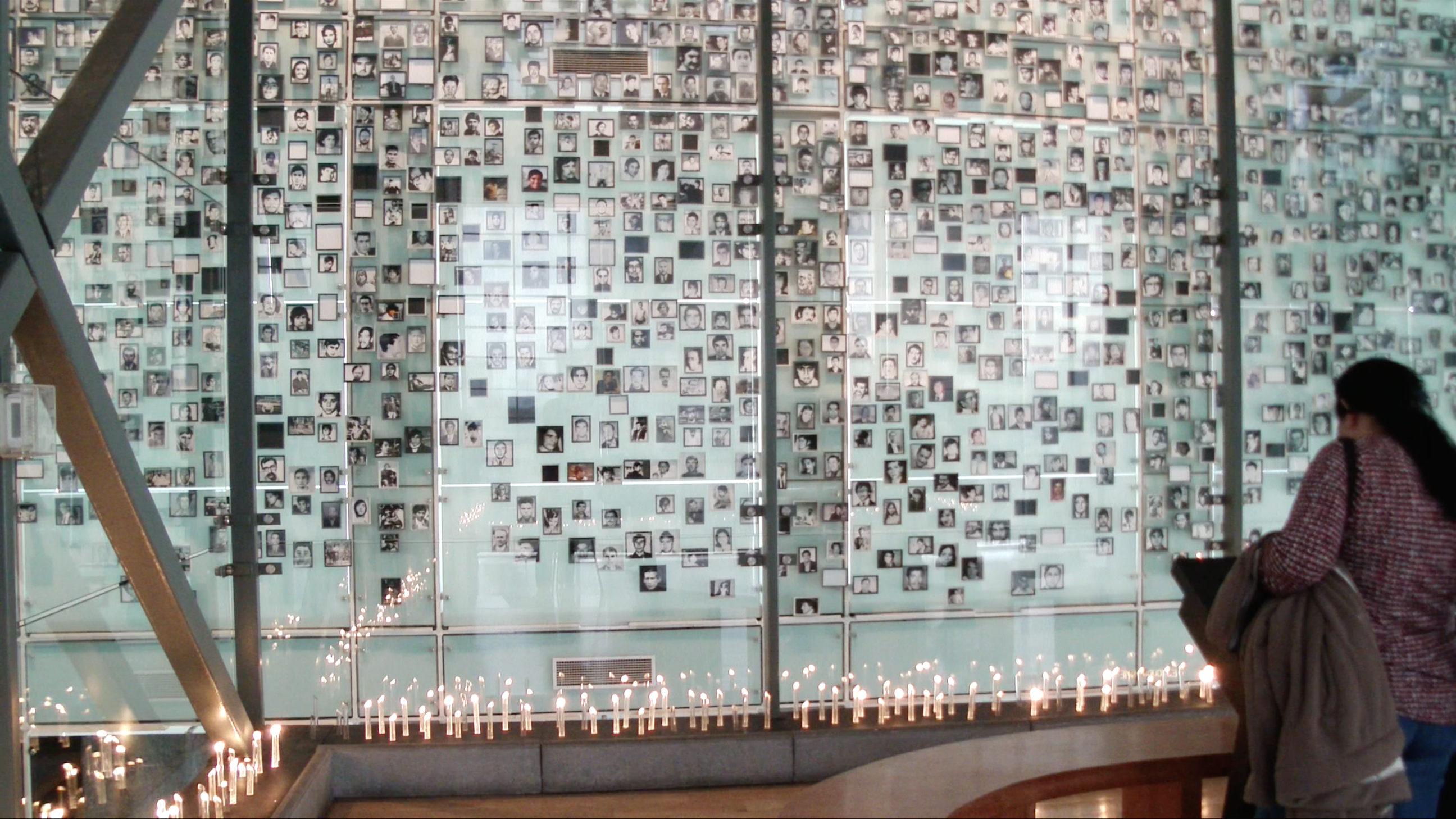 A wall with photographs of those who victims of the Pinochet regime. Image by Natalie Oren. Chili, 2016. A wall with photographs of those who victims of the Pinochet regime.