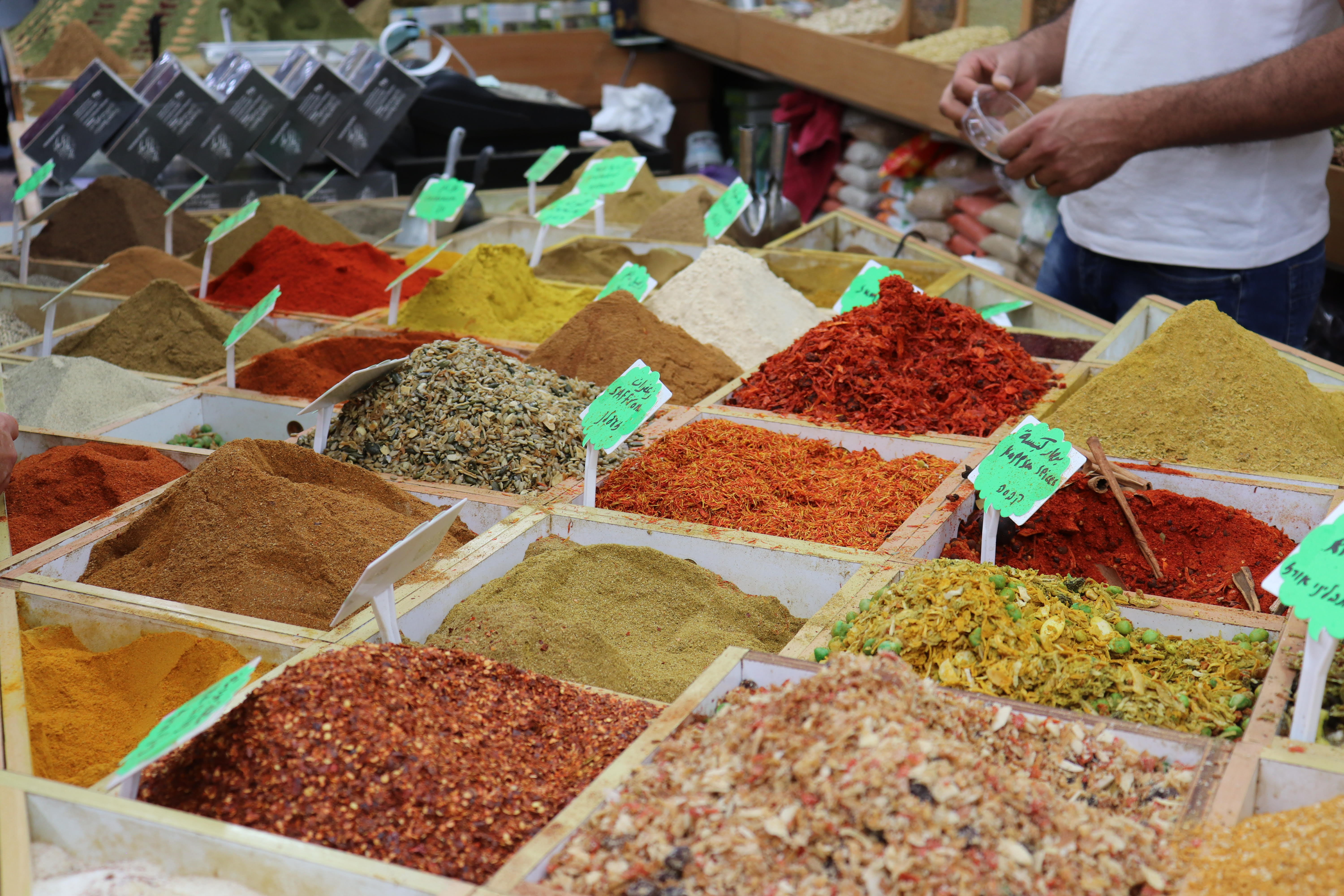 A spice shop in the Muslim Quarter of Jerusalem's Old City. Za'atar, an herb mix ubiquitous in the region's cuisine, once grew wild all over what's now in the West Bank. A 1977 Israeli law criminalized the harvesting of the herb. Israelis say it protects an endangered plant species. Palestinians say it's another way to erase their identity and limit their ability to cook their traditional dishes. Image by Carly Graf. West Bank, 2019. A spice shop in the Muslim Quarter of Jerusalem's Old City. Za'atar, an herb mix ubiquitous in the region's cuisine, once grew wild all over what's now in the West Bank. A 1977 Israeli law criminalized the harvesting of the herb. Israelis say it protects an endangered plant species. Palestinians say it's another way to erase their identity and limit their ability to cook their traditional dishes. Image by Carly Graf. West Bank, 2019.
