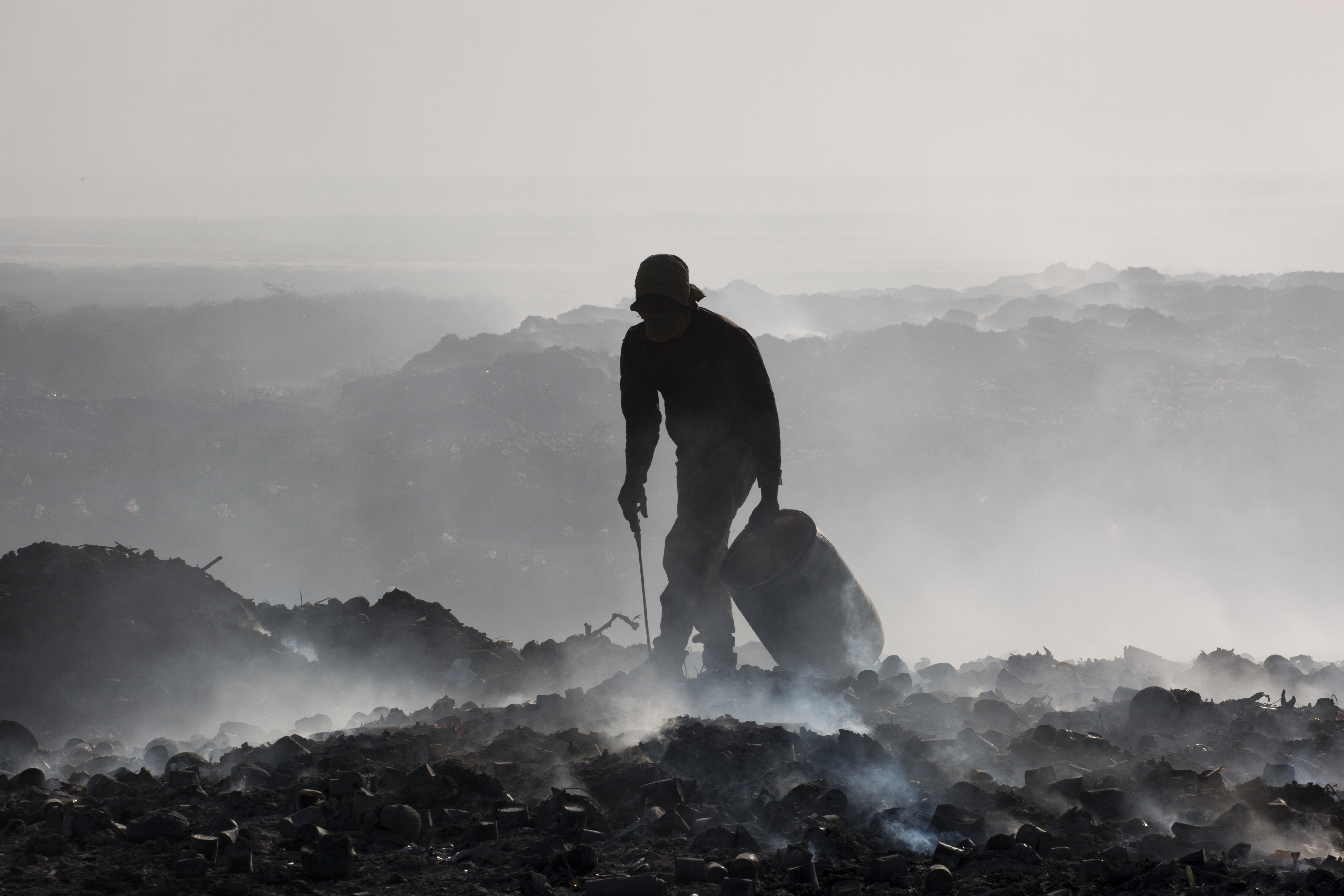 After the 2010 earthquake, NGOs dumped hundreds of thousands of gallons of raw sewage at the end of the Port-au-Prince city landfill, which borders the sea and is not lined with an impermeable material. Image by Marie Arago/NPR. Haiti, 2017. After the 2010 earthquake, NGOs dumped hundreds of thousands of gallons of raw sewage at the end of the Port-au-Prince city landfill, which borders the sea and is not lined with an impermeable material. Image by Marie Arago/NPR. Haiti, 2017.