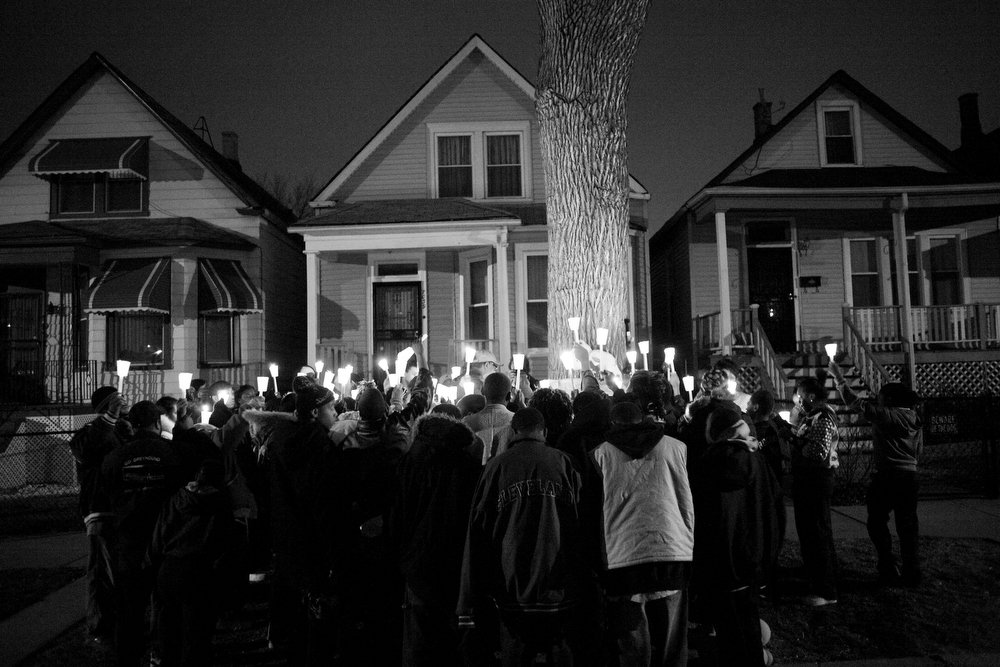 Albert Vaughn was the neighborhood guardian, the older teenager who would play ball with the younger kids and try to keep them safe from trouble. About 50 people gathered including his family members and friends to remember Little Al on the block where he was killed. Image by Rieke Havertz. Chicago, 2013. Media file: ortiz-034.jpg