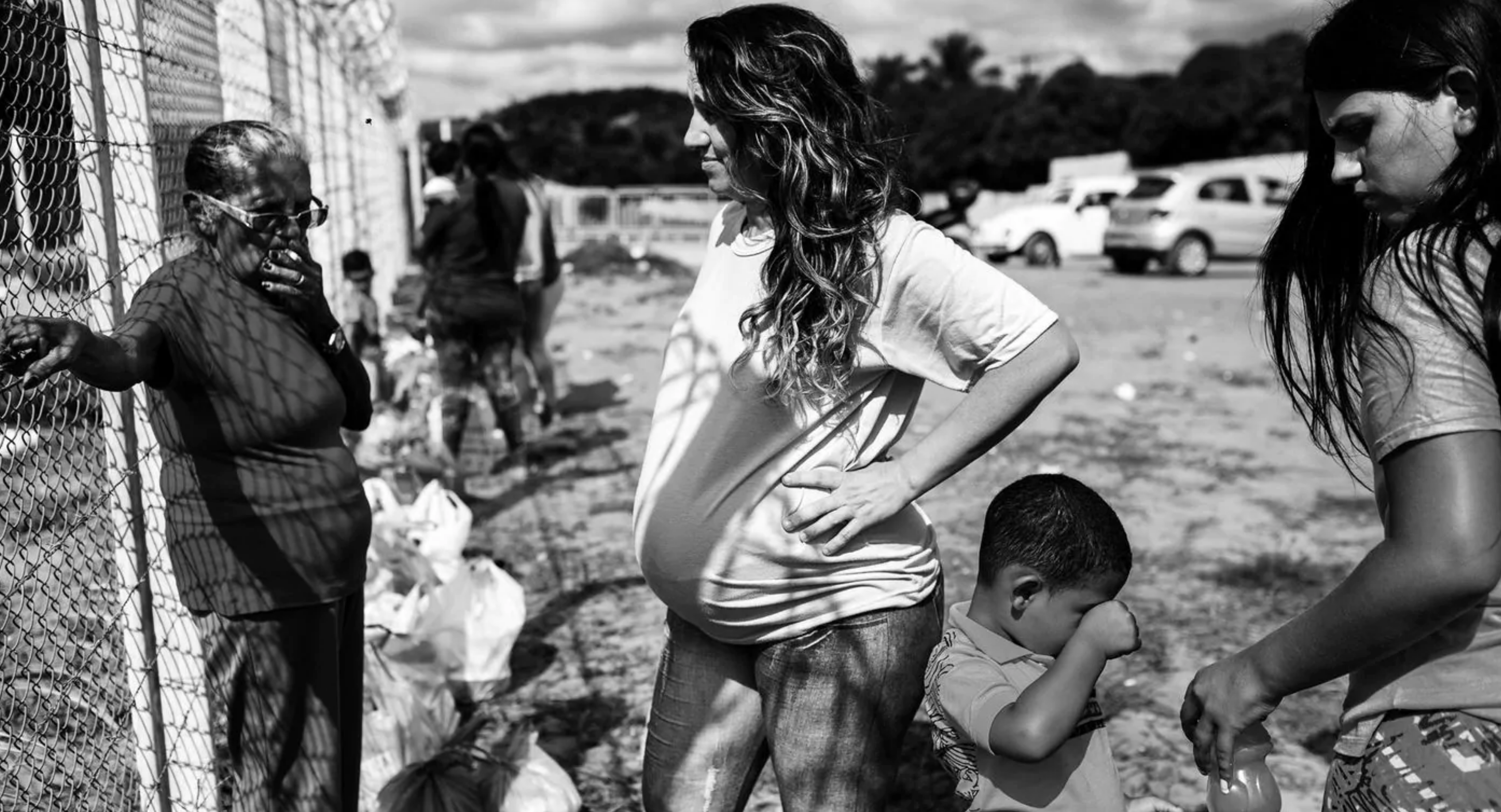 A pregnant woman, who did not want to be identified, waits for the gates to open to visit her boyfriend outside Alcaçuz Federal Penitentiary. Image by Lianne Milton. Brazil, 2018. A pregnant woman, who did not want to be identified, waits for the gates to open to visit her boyfriend outside Alcaçuz Federal Penitentiary. Image by Lianne Milton. Brazil, 2018.