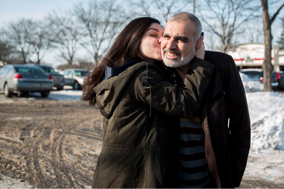 Zahra Ahmad kisses her father, Mohammad Ahmad Sibte, whom she calls Baba, on the cheek before departing to Iraq from Detroit on Feb. 1, 2019. Zahra's parents, Mohammad Ahmad Sibte and Lamiya Adil Mahdi, survived the Irani-Iraqi revolution. Image by Brontë Wittpenn. United States, 2019. Zahra Ahmad kisses her father, Mohammad Ahmad Sibte, whom she calls Baba, on the cheek before departing to Iraq from Detroit on Feb. 1, 2019. Zahra's parents, Mohammad Ahmad Sibte and Lamiya Adil Mahdi, survived the Irani-Iraqi revolution. Image by Brontë Wittpenn. United States, 2019.