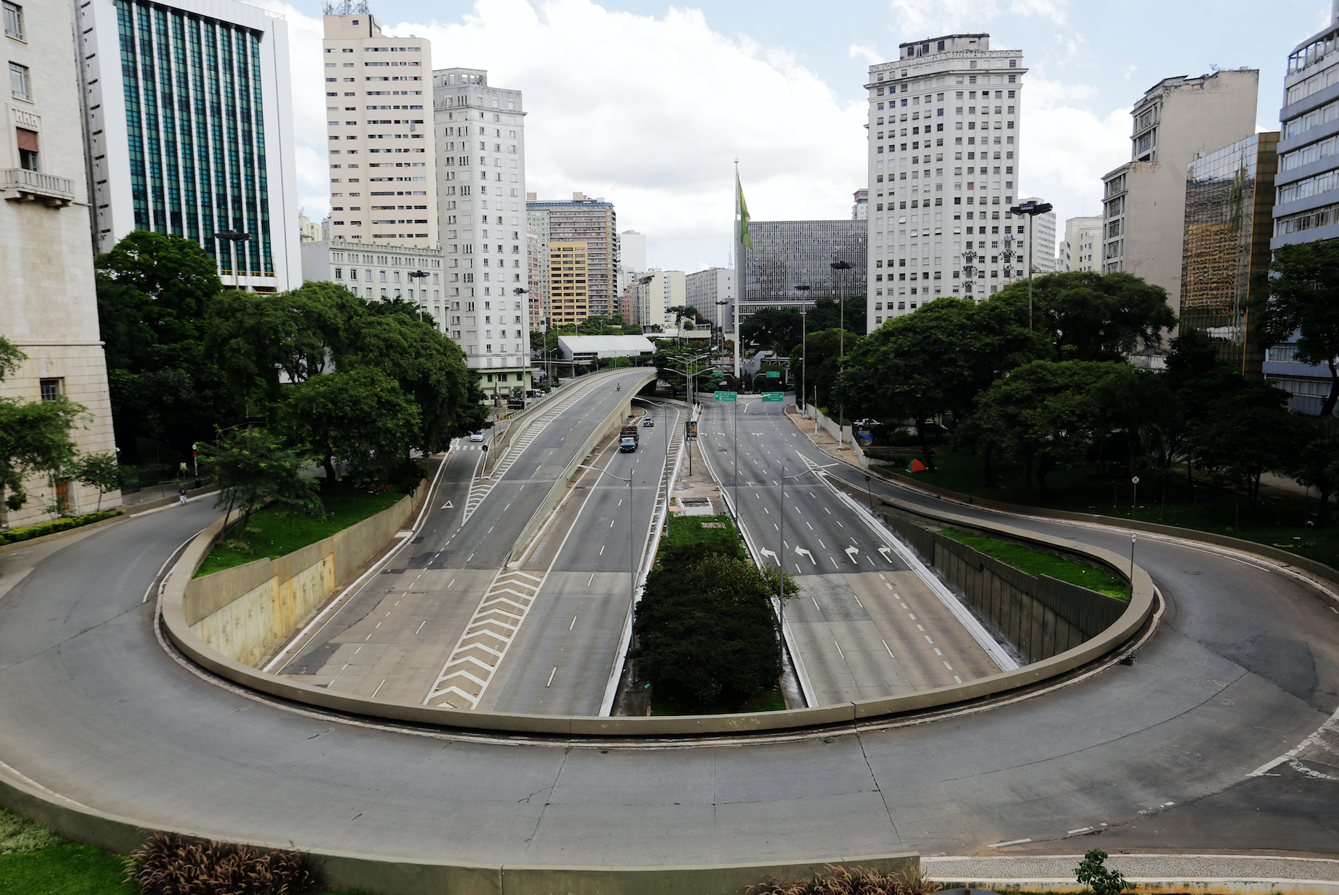 An empty street and avenue are seen in downtown São Paulo due to coronavirus outbreak. Image by Nelson Antoine / Shutterstock. Brazil, 2020. An empty street and avenue are seen in downtown São Paulo due to coronavirus outbreak. Image by Nelson Antoine / Shutterstock. Brazil, 2020.
