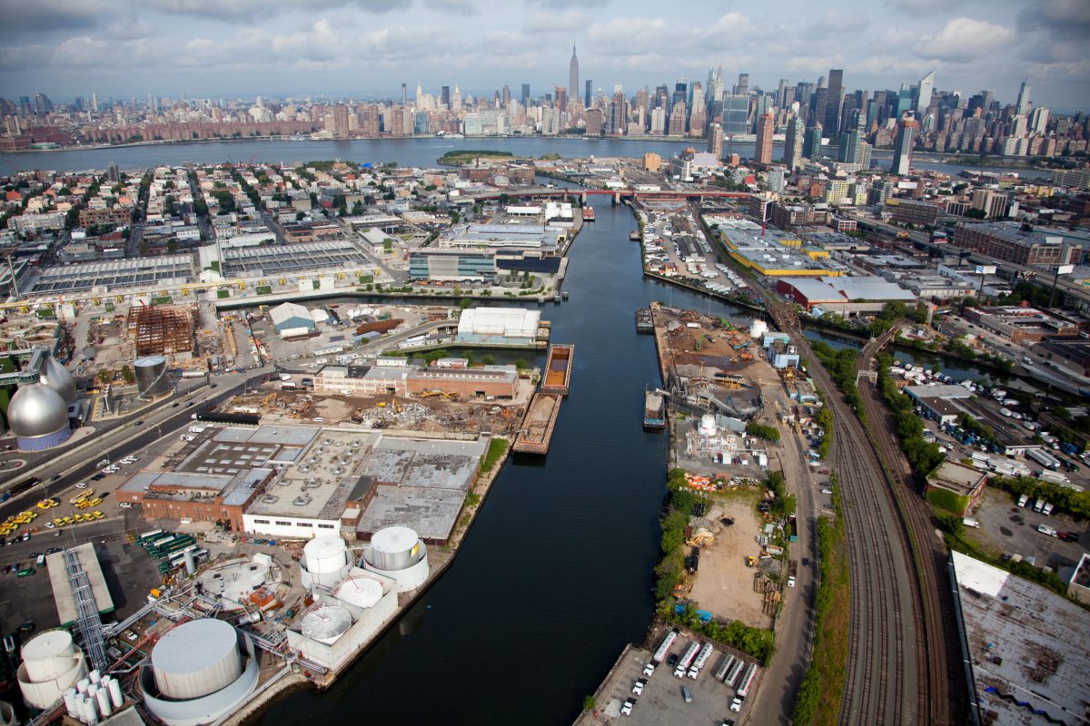 Newtown Creek, a 5.5 kilometer-long tributary of New York’s East River, is one of the most heavily industrialized and polluted sites in the United States. Water overflowed the armored banks of the waterway during Hurricane Sandy, spreading untreated sewage and toxic chemicals into city streets and basements. The Newtown Creek Wastewater Treatment Plant (the silver egg-shaped tanks on the far left), the largest of New York’s 14 sewage processing facilities, was responsible for the sewage—it released 550 million liters after becoming submerged. Image by Alex MacLean. United States, 2019. Newtown Creek, a 5.5 kilometer-long tributary of New York’s East River, is one of the most heavily industrialized and polluted sites in the United States. Water overflowed the armored banks of the waterway during Hurricane Sandy, spreading untreated sewage and toxic chemicals into city streets and basements. The Newtown Creek Wastewater Treatment Plant (the silver egg-shaped tanks on the far left), the largest of New York’s 14 sewage processing facilities, was responsible for the sewage—it released 550…