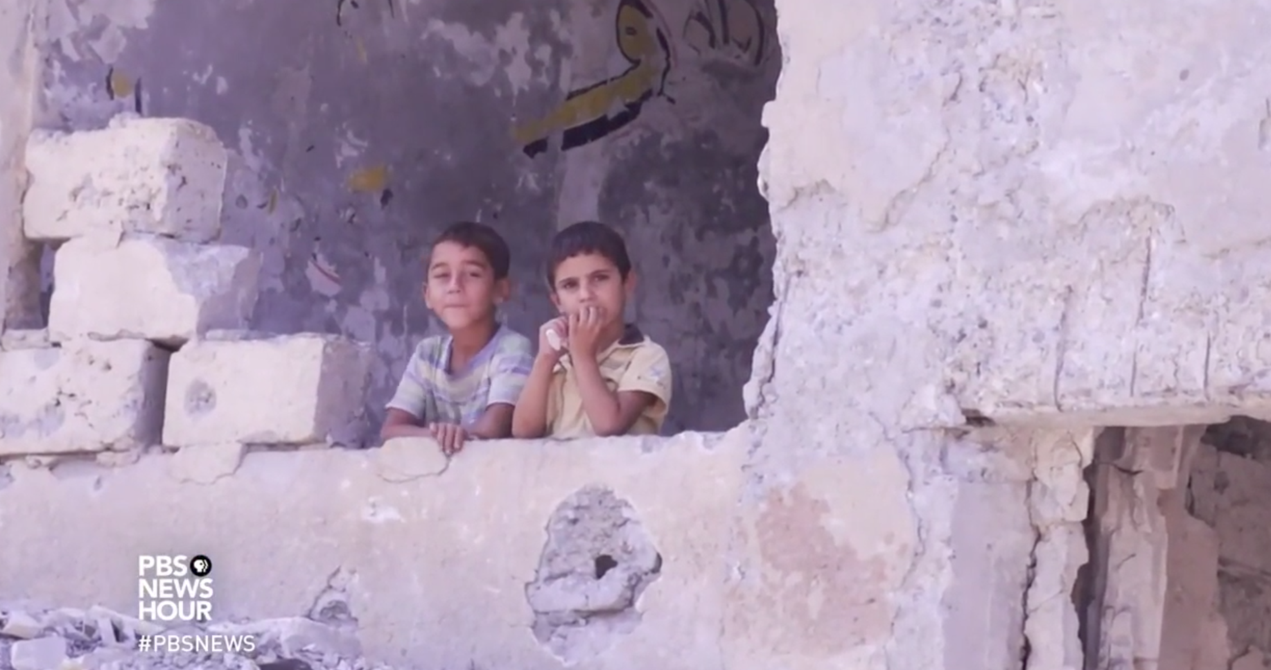 Still image taken from PBS NewsHour video, "Syrians try to salvage life from the wreckage of Raqqa." Syria, 2017. Still image taken from PBS NewsHour video, Syrians try to salvage life from the wreckage of Raqqa. Aired August 16, 2017.