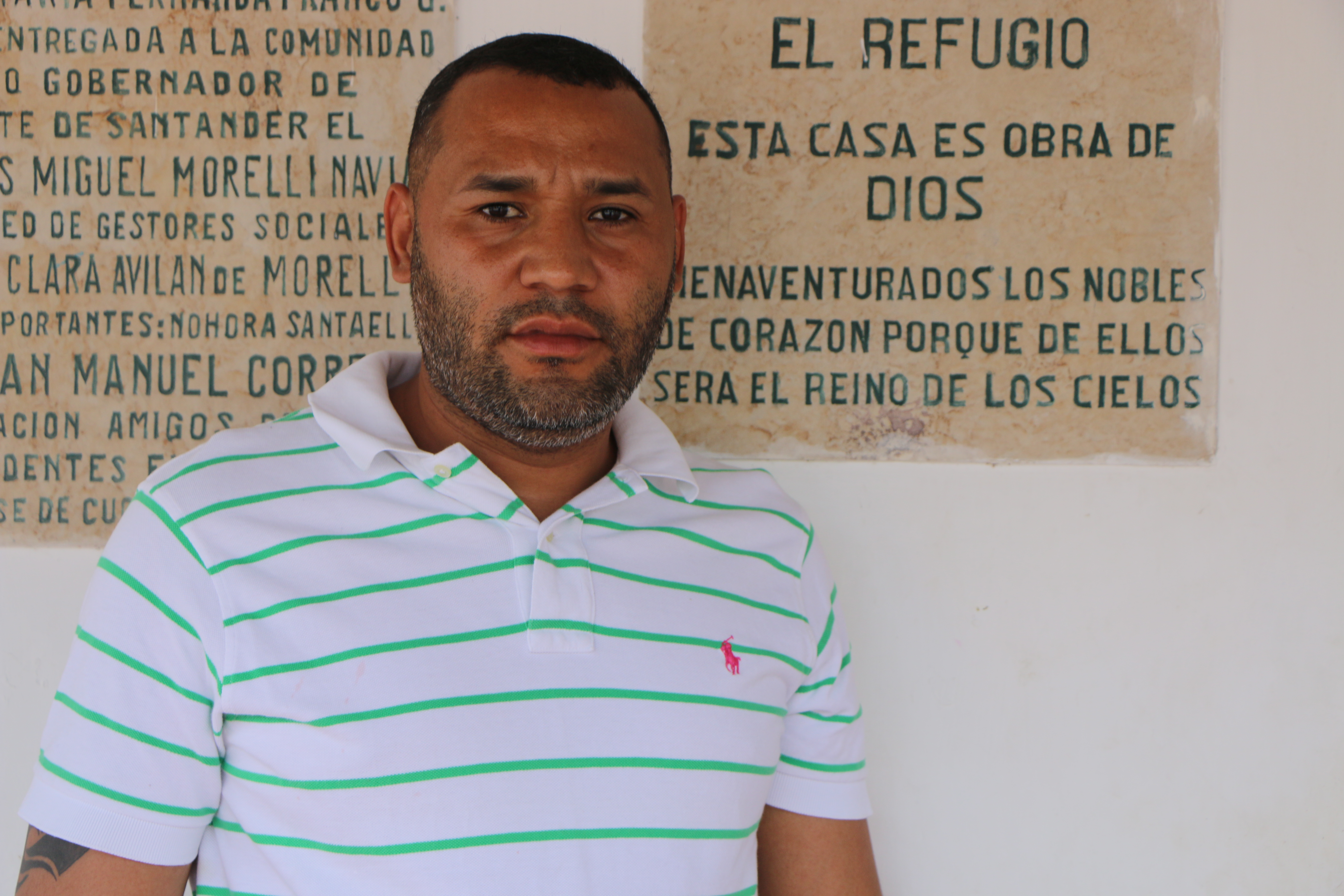 Ex-police officer Pedro Gonzalez Diaz standing outside of Fundación Hoasis, where he has lived for the past year. Image by Patrick Ammerman. Colombia, 2019.