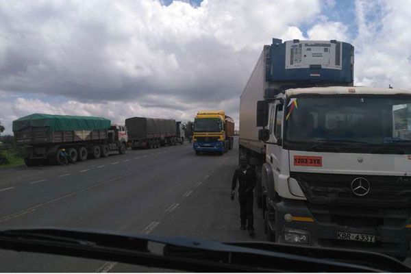 Trucks parked by the roadside in Longonot center on the Maai Mahiu-Naivasha road. Image by Beatrice Obwocha. Kenya, 2016.