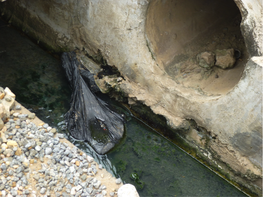 "Takeaway" is a form of open defecation whereby people relieve themselves in plastic bags, which they then dump in gutters or in trash piles. Image by Diksha Bali. Ghana, 2013. Media file: takeaway.png