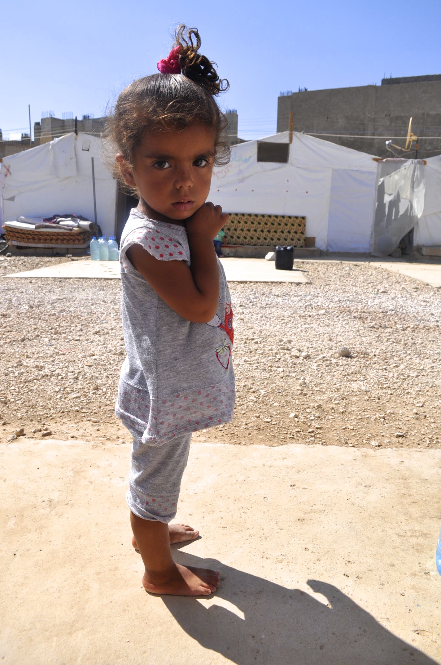 Aya lives in an informal tent settlement in Lebanon’s Bekaa valley. Her family is Palestinian-Syrian, which means they are double refugees. Lebanon is now denying Palestinians from Syria entry, and has forbidden those already here from renewing their residencies—so they become de facto illegal, vulnerable to detainment and deportation at any time. Image by Alice Su. Lebanon, 2014. Media file: dsc_0076.jpg