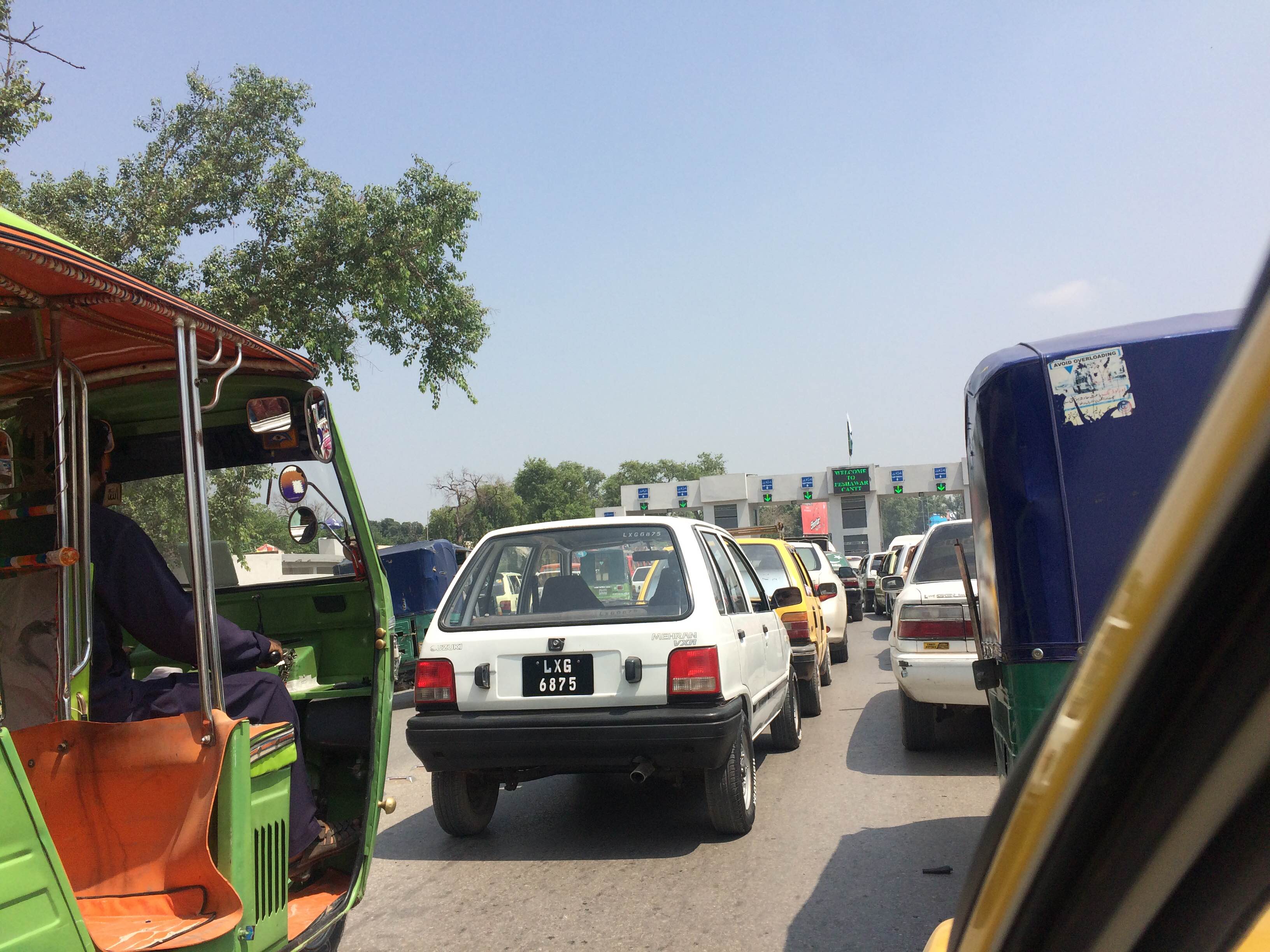Traffic backs up at what will probably become a permanent checkpoint in Peshawar. Image by Umar Farooq. Pakistan, 2017. Traffic backs up at what will probably become a permanent checkpoint in Peshawar. Image by Umar Farooq. Pakistan, 2017.