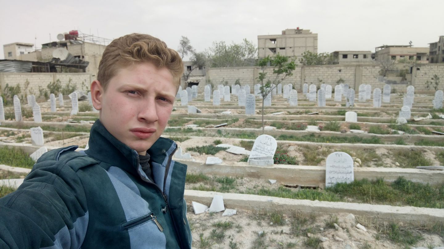 Muhammad Najem visits the tomb of his father one final time before being evacuated from Eastern Ghouta. Image courtesty of Muhammad Najem/Facebook. Syria, 2018. Muhammad Najem visits the tomb of his father one final time before being evacuated from Eastern Ghouta. Image courtesty of Muhammad Najem/Facebook. Syria, 2018.