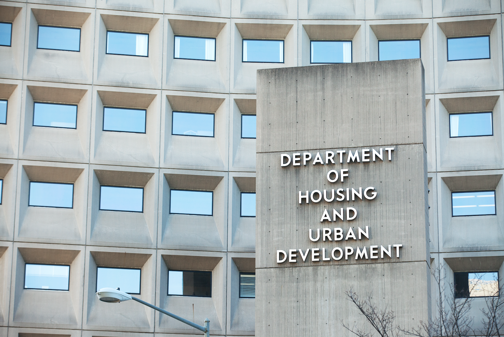 Sign in front of the Department of Housing and Urban Development in downtown Washington, D.C. Image by Mark Van Scyoc / Shutterstock. United States, 2014. Sign in front of the Department of Housing and Urban Development in downtown Washington, D.C. Image by Mark Van Scyoc / Shutterstock. United States, 2014.