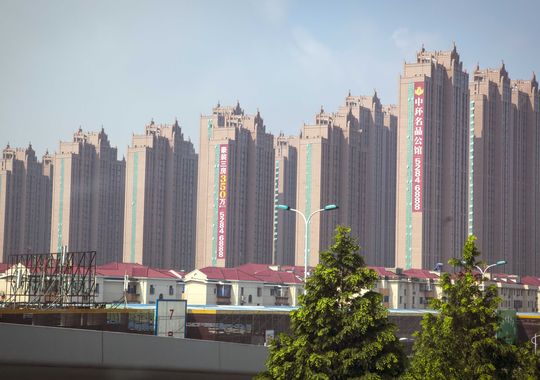 Mega-apartment buildings are being built in the Shanghai area. Image by Rodney White. China, 2014. Media file: 1409676143000-apartmentcostliving1.jpg