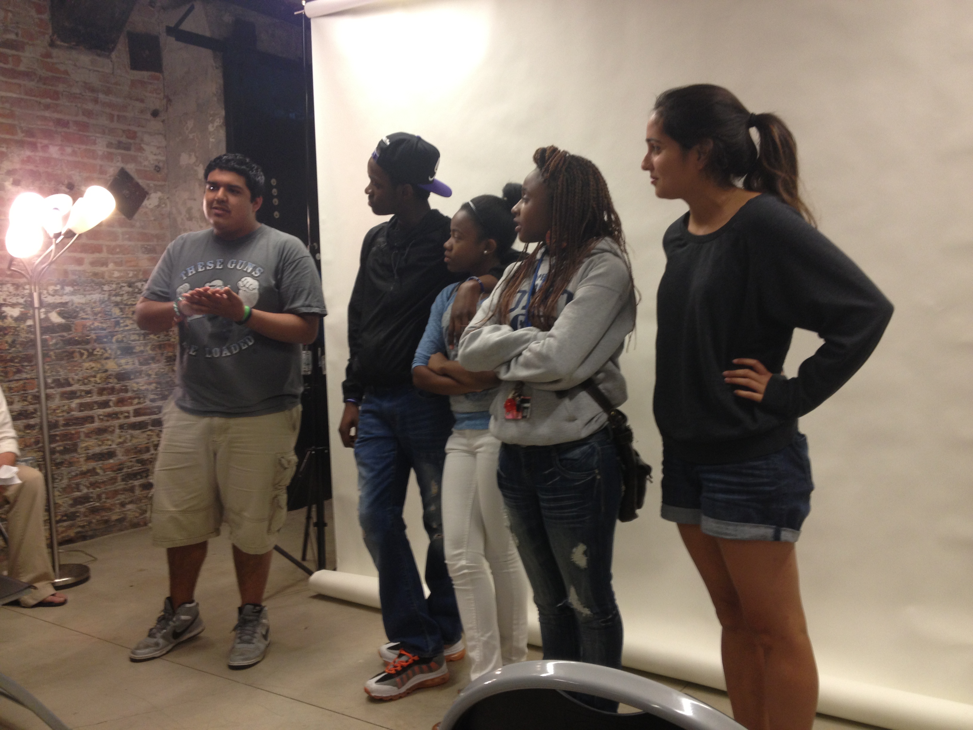 The team that produced "I Am Happy," a short documentary on teen suicide in Chicago, presents their work alongside their mentor, Meghan Dhaliwal. Photo by Amanda Ottaway. Chicago, 2013. Media file: img_2764.jpg