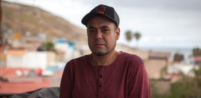 Deported veteran Miguel Perez stands for a portrait in Tijuana, Mexico on May 7, 2019. After being pardoned by Illinois Gov. JB Pritzker, he is asking officials to reconsider his citizenship application. Image courtesy of Erin Siegal McIntyre. Mexico, 2019. Deported veteran Miguel Perez stands for a portrait in Tijuana, Mexico on May 7, 2019. After being pardoned by Illinois Gov. JB Pritzker, he is asking officials to reconsider his citizenship application. Image courtesy of Erin Siegal McIntyre. Mexico, 2019.