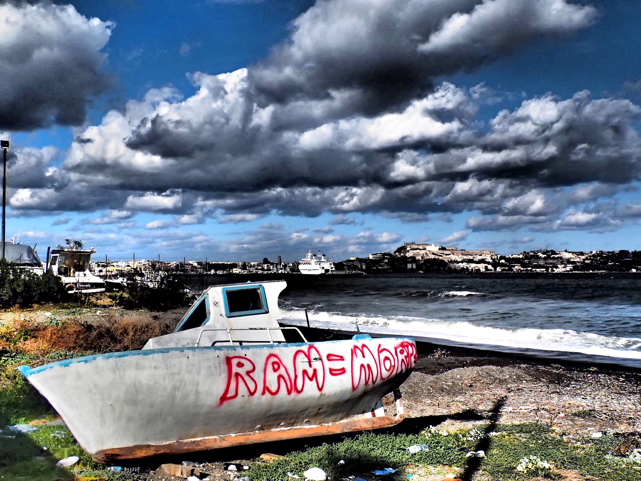 Boat wreck in Milazzo, Italy. Image courtesy of Sarah Tzinieris/Creative Commons. Italy, 2015. Boat wreck in Milazzo, Italy. Image courtesy of Sarah Tzinieris. Italy, 2015.