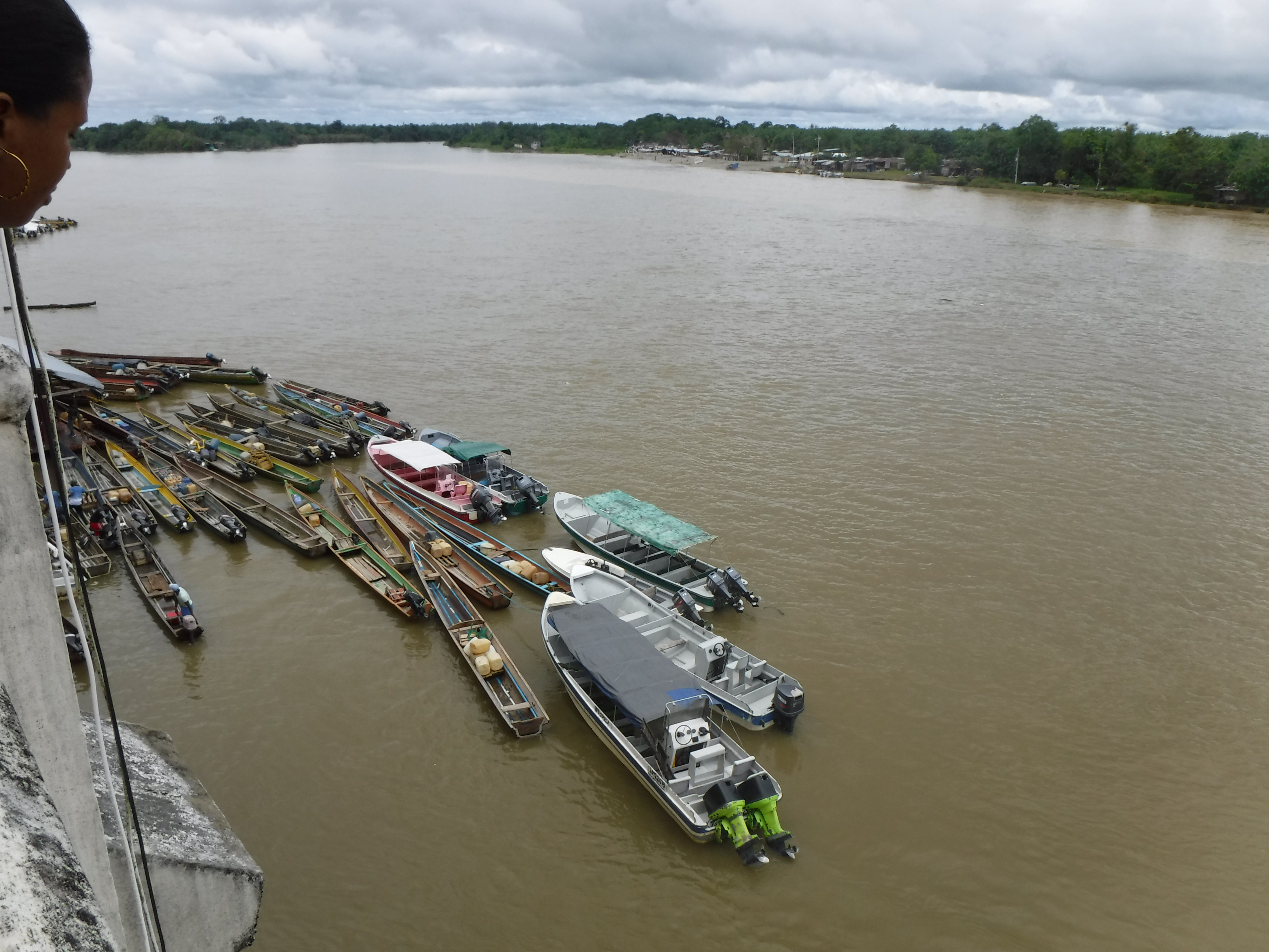 Canoes docked by Chocó's capital city, Quibdó. The Río Atrato links the region and serves as the primary transportation for many communities that lack access to paved roads. Image by Julia Friedmann. Colombia, 2018. Canoes docked by Chocó's capital city, Quibdó. The Río Atrato links the region and serves as the primary transportation for many communities that lack access to paved roads. Image by Julia Friedmann. Colombia, 2018.