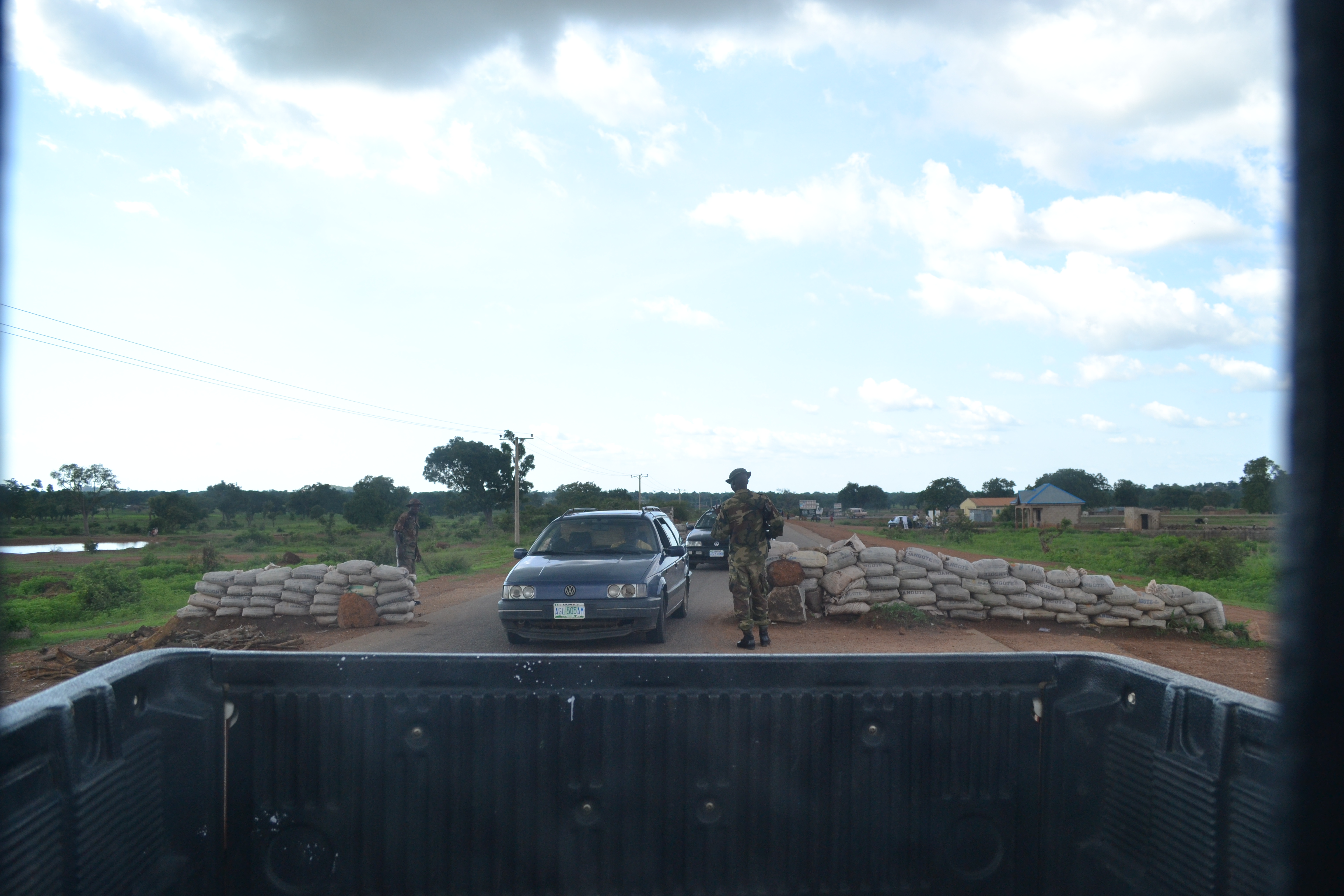Military Personnel at one of several check points on a major high way that leads to Boko Haram hot spot in northeast Nigeria. Locals call it 'hayan Iraq' which means Iraq Road. Image by Ameto Akpe. Nigeria, 2013 . Media file: dsc_0216.jpg