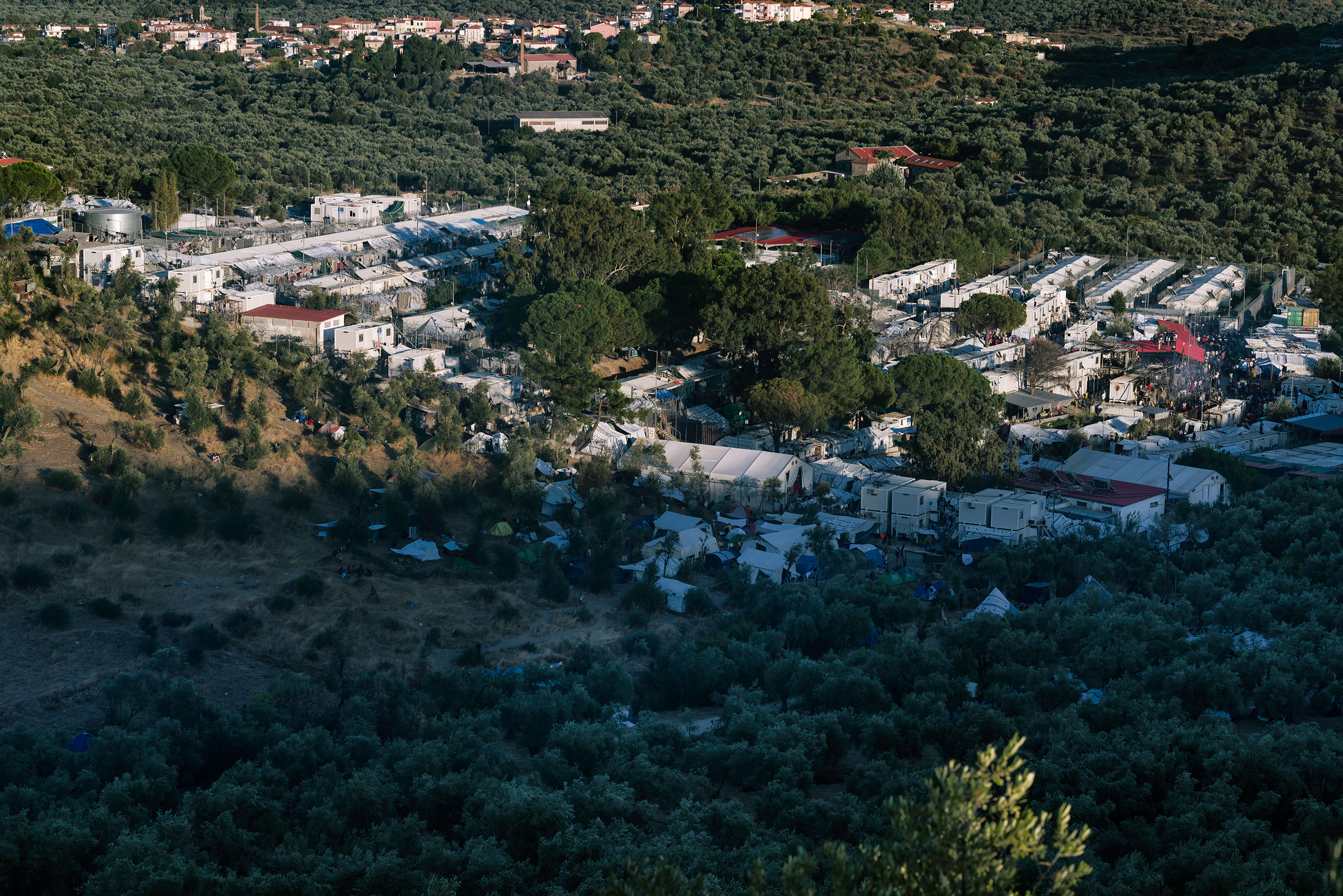 A view of the Moria refugee camp in September 2019. Thousands have been left homeless after a fire destroyed the camp. Image by Aleksandra H. Kossowska / Shutterstock. Greece, 2019. A view of the Moria refugee camp in September 2019. Thousands have been left homeless after a fire destroyed the camp. Image by Aleksandra H. Kossowska / Shutterstock. Greece, 2019.