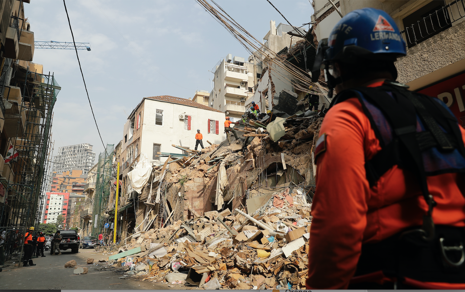 Rescue workers dig through the rubble of a badly damaged building in Lebanon's capital, Beirut, in search of possible survivors from a mega-blast at the adjacent port one month ago, after scanners detected a pulse, on September 3, 2020. A sniffer dog used by Chilean rescuers responded to a scent from the site of a collapsed building in the Gemmayzeh area, the city's governor told reporters at the scene. Image by Joseph Eid/AFP. Lebanon, 2020. Rescue workers dig through the rubble of a badly damaged building in Lebanon's capital, Beirut, in search of possible survivors from a mega-blast at the adjacent port one month ago, after scanners detected a pulse, on September 3, 2020. A sniffer dog used by Chilean rescuers responded to a scent from the site of a collapsed building in the Gemmayzeh area, the city's governor told reporters at the scene. Image by Joseph Eid/AFP. Lebanon, 2020.