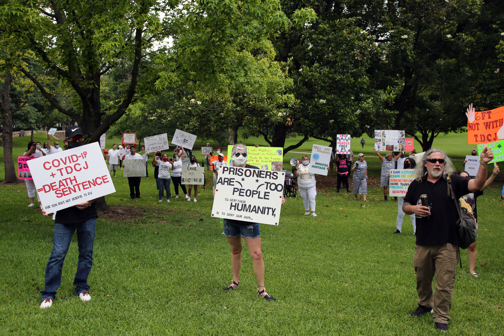 Family members of prisoners held in Texas' state prison system demonstrate at the Governor's Mansion in Austin for their release on parole due to the danger of COVID-19 in prisons. Image by Vic Hinterlang / Shutterstock. United States, 2020. Family members of prisoners held in Texas' state prison system demonstrate at the Governor's Mansion in Austin for their release on parole due to the danger of COVID-19 in prisons. Image by Vic Hinterlang / Shutterstock. United States, 2020.