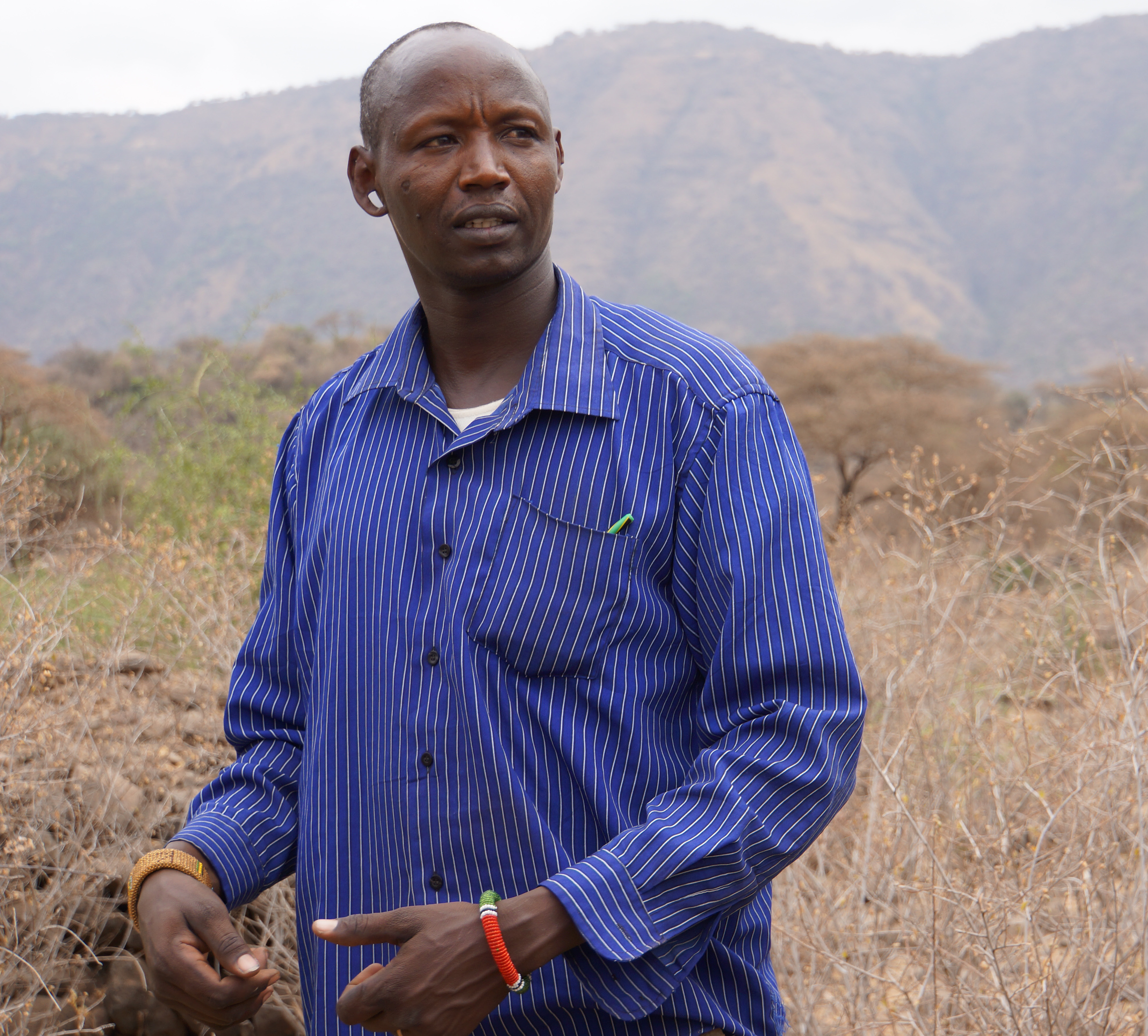Engaruka Village Executive Officer, Konio Ndoika, welcomed visitors who hadn't been able to call ahead. Image by Sharon Schmickle. Tanzania, 2013. Media file: engaruka_village_executive_officer_konio_ndoika.jpg