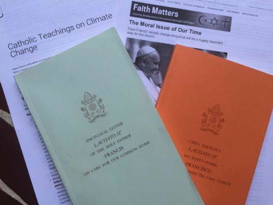 Printed version of the papal encyclical from the Vatican, offered in English and Portuguese. Image by Justin Catanoso. Peru, 2015. Media file: the_pope_and_the_environment_.jpg
