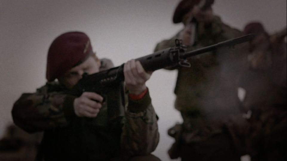A soldier shoots a gun during a scene in The Ballymurphy Precedent trailer. Image courtesy of Dartmouth Films. Ireland, 2018. A soldier shoots a gun during a scene in The Ballymurphy Precedent trailer. Image courtesy of Dartmouth Films. Ireland, 2018.